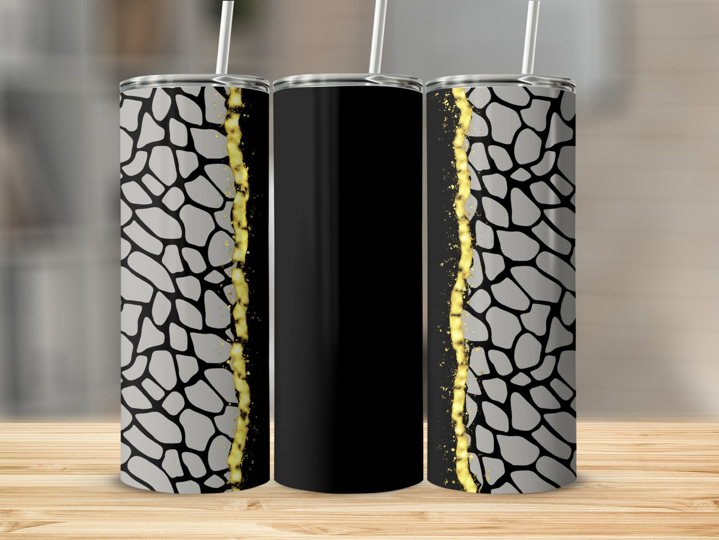 Black tumbler with giraffe print and gold glitter accent.