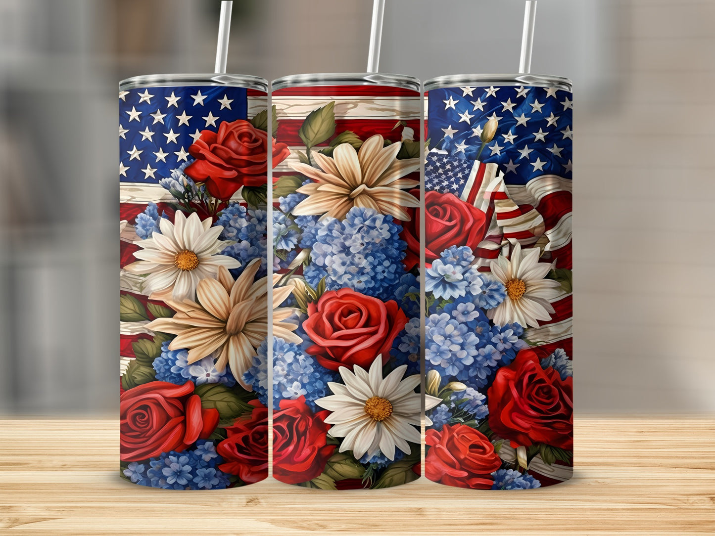 Three tumblers with American flag and floral designs featuring red roses and white daisies.