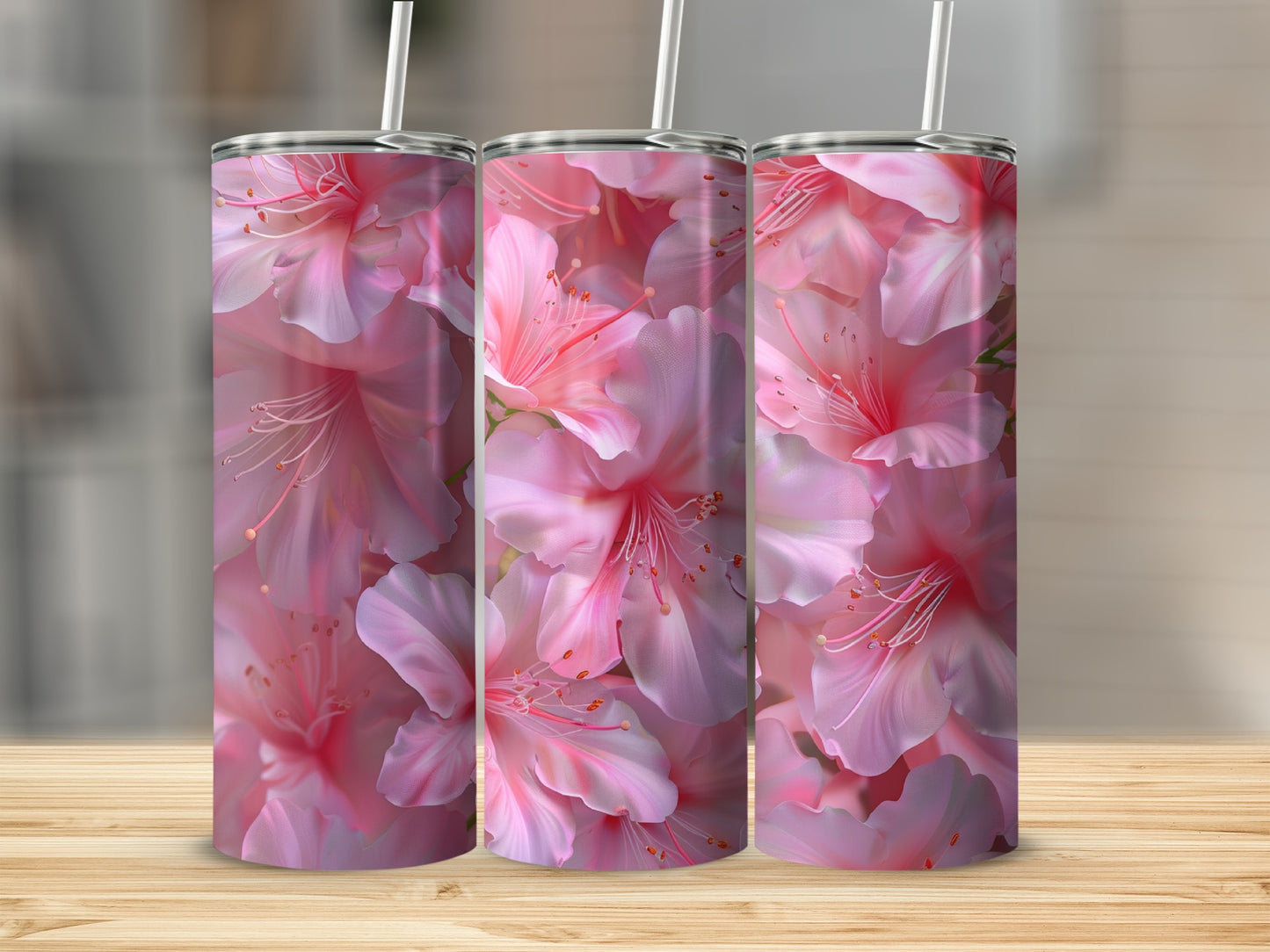 Three tumblers with a close-up floral pink lily design.