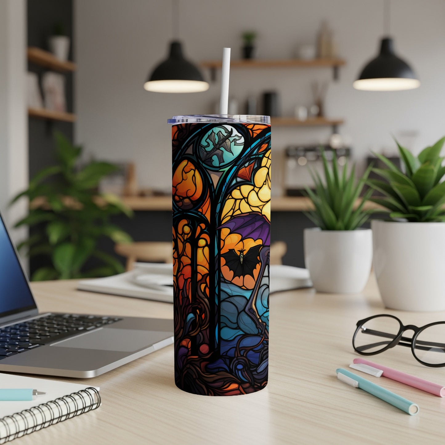 Stained glass tumbler with bat and moon Halloween design.