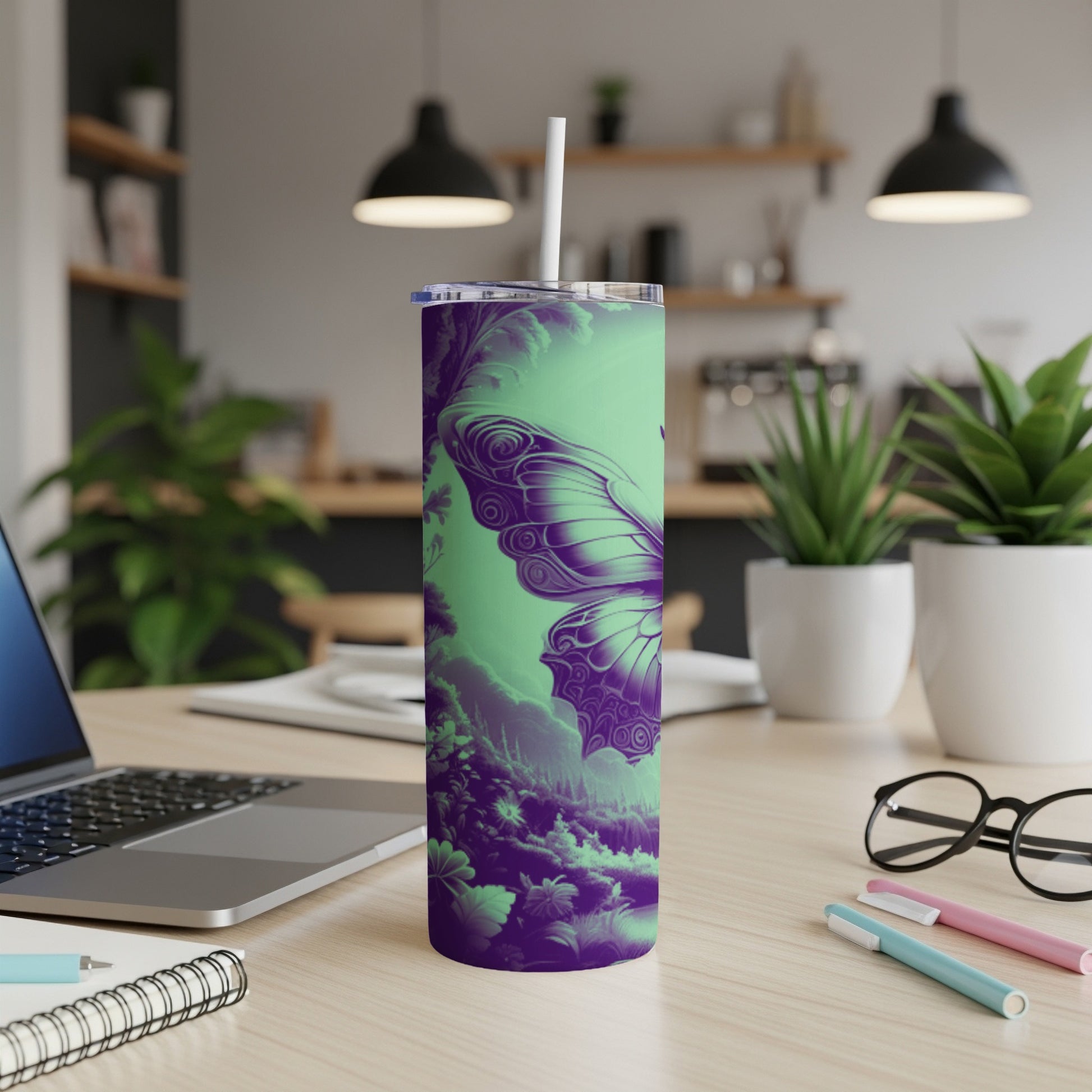 Purple and green butterfly design on a tumbler with a straw.