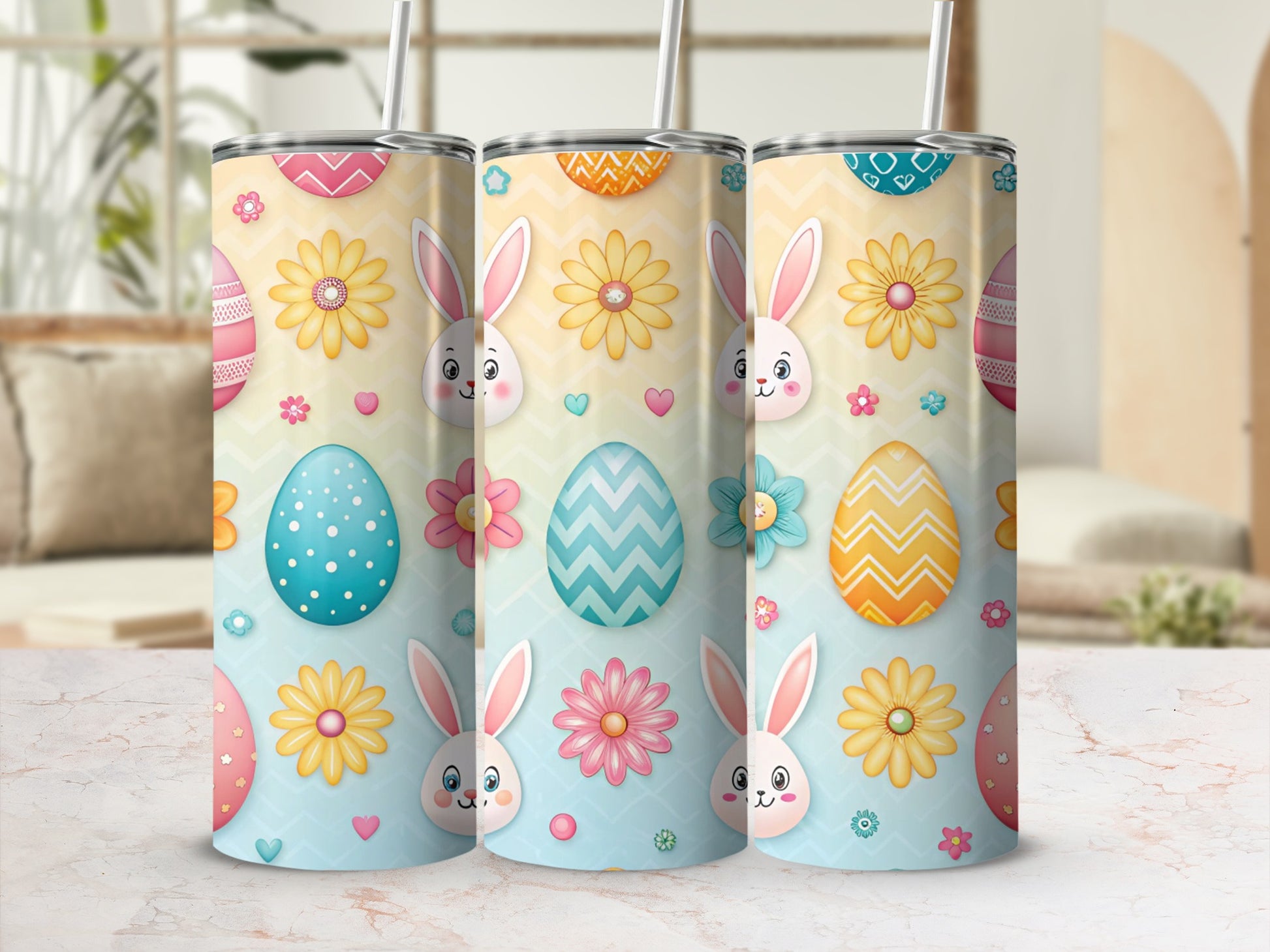 Three Easter-themed tumblers with bunnies, eggs, and flowers.