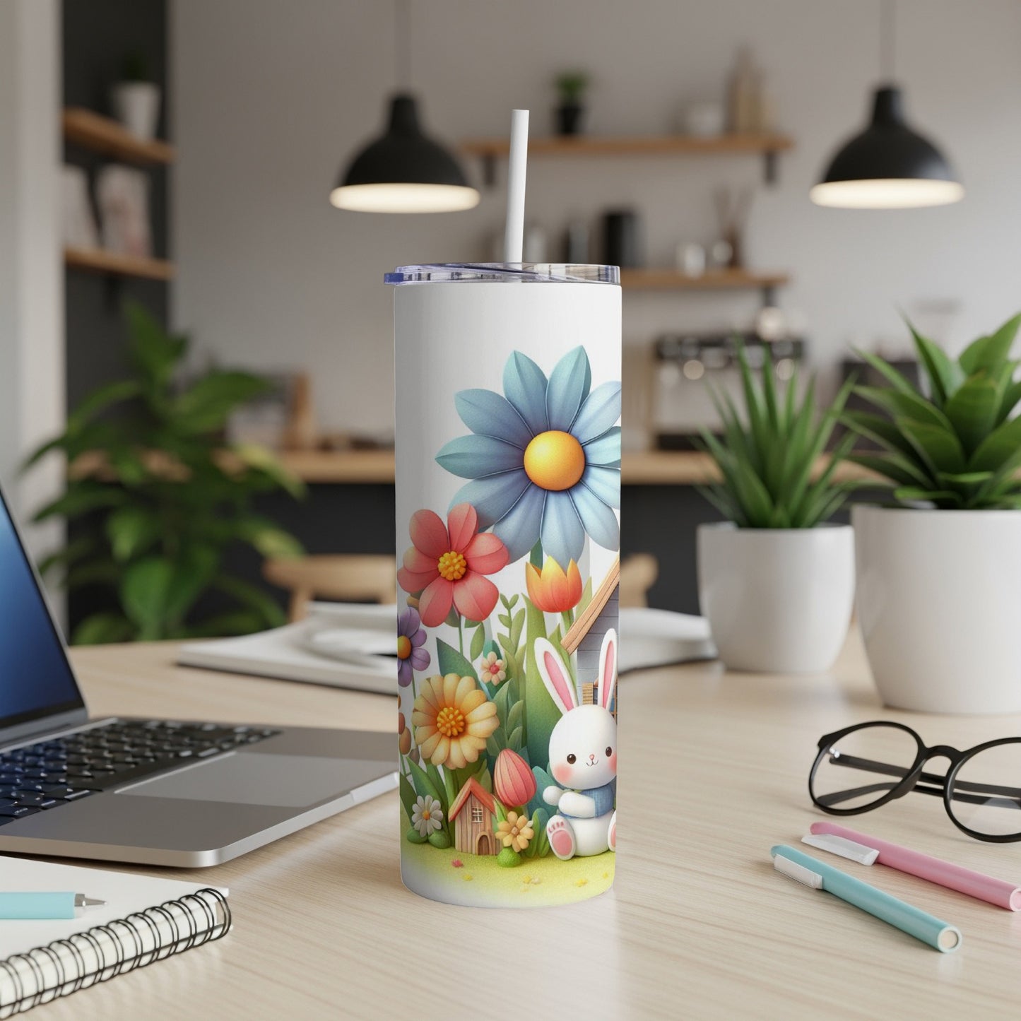 White tumbler with pastel floral and bunny design.