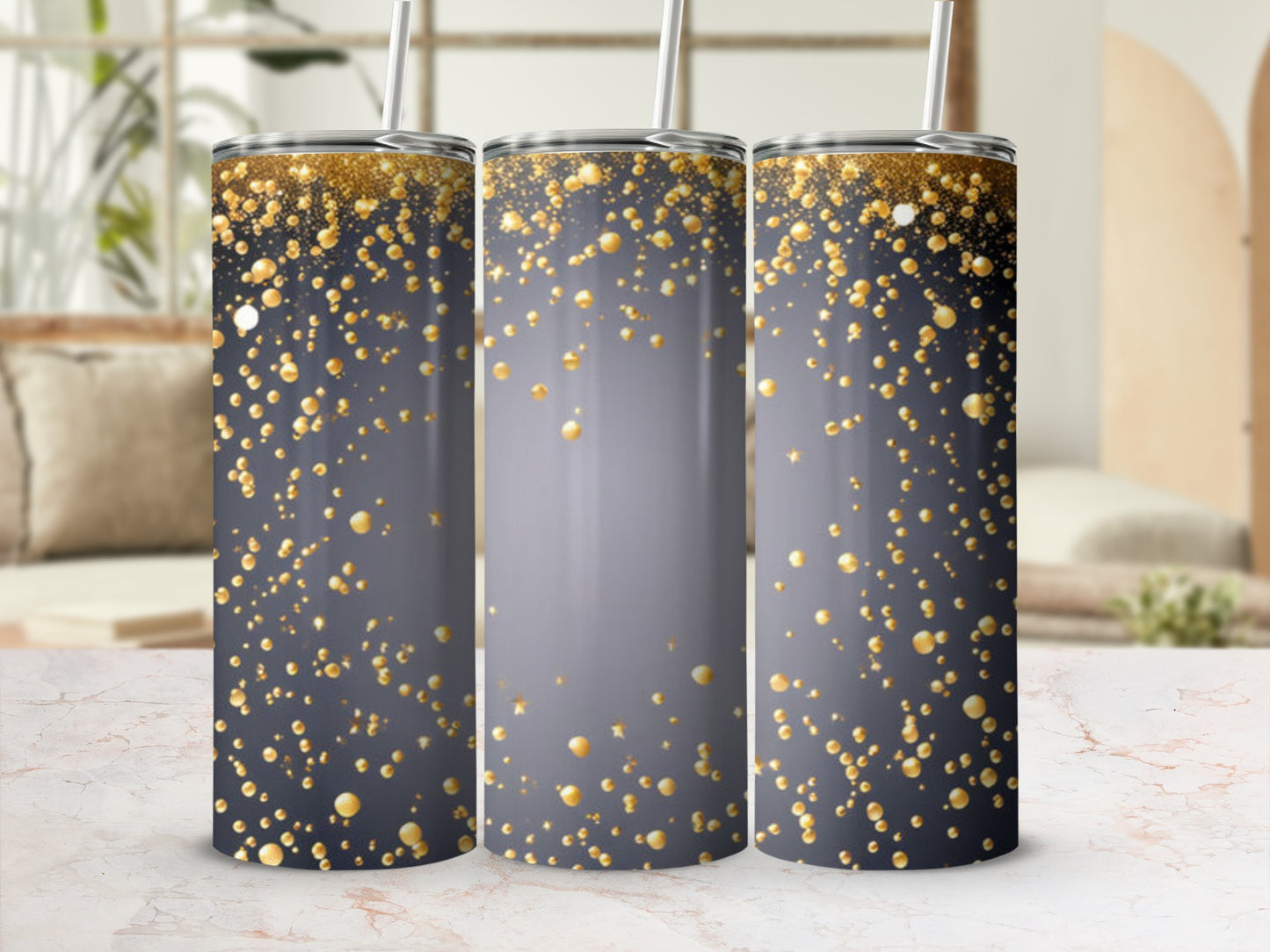 Glittering gold bubbles on a dark gray gradient tumbler with straw.