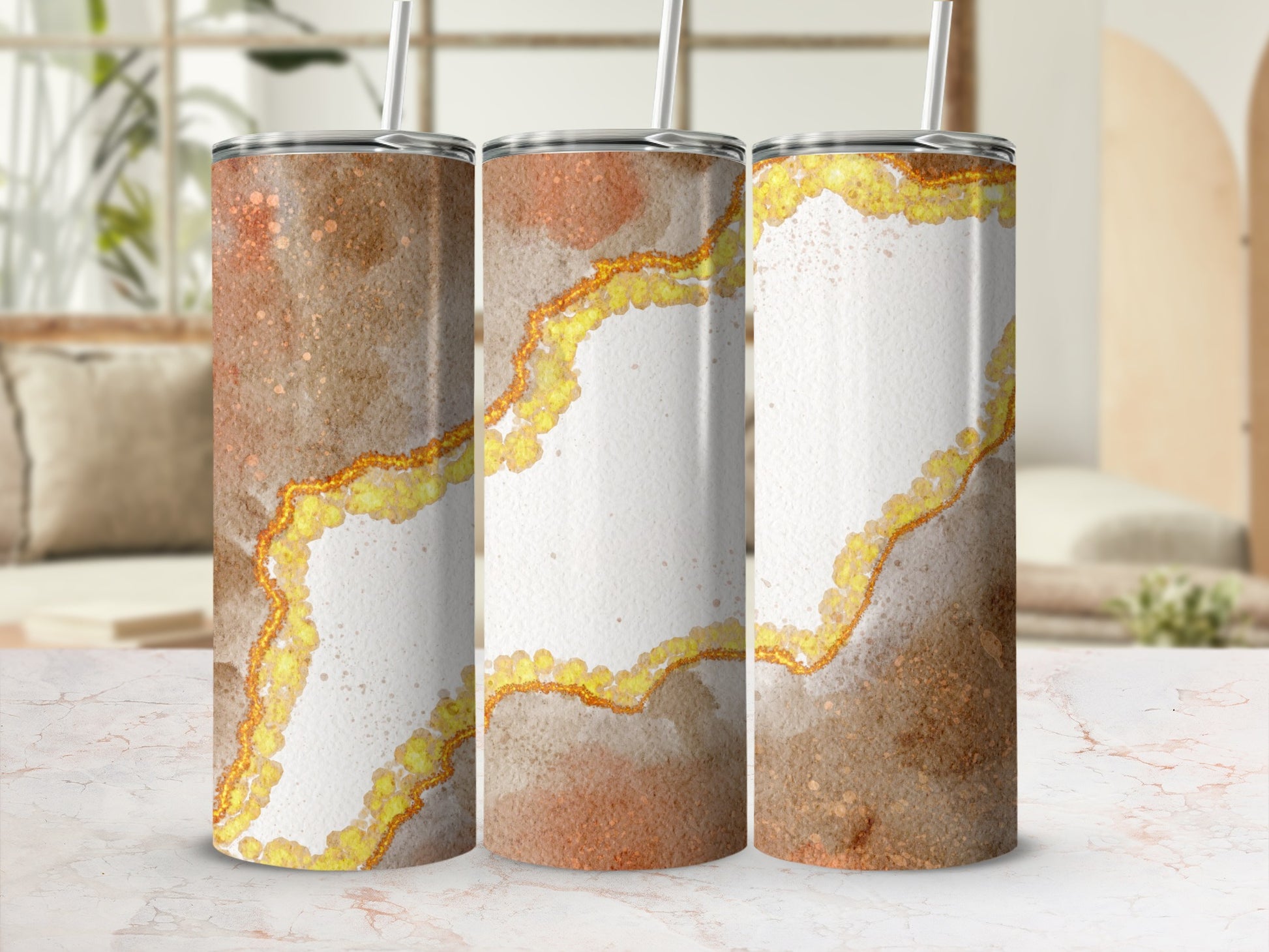 Three tumblers with glitter and marbled brown and gold design.