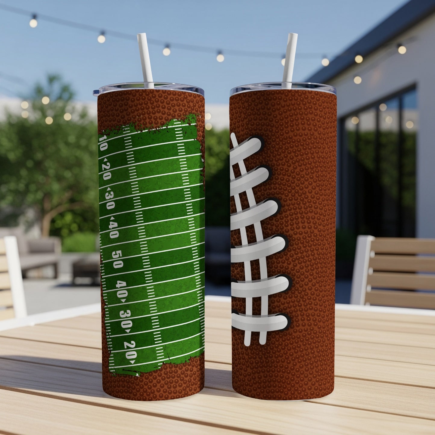 Two football-themed tumblers on a wooden table.