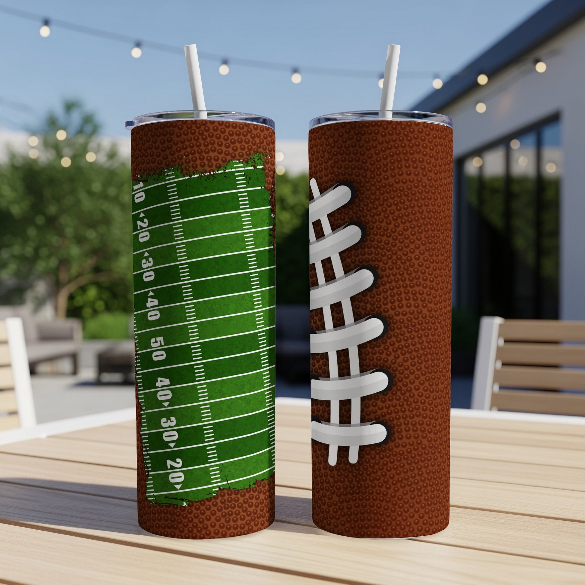 Two football-themed tumblers on a wooden table.