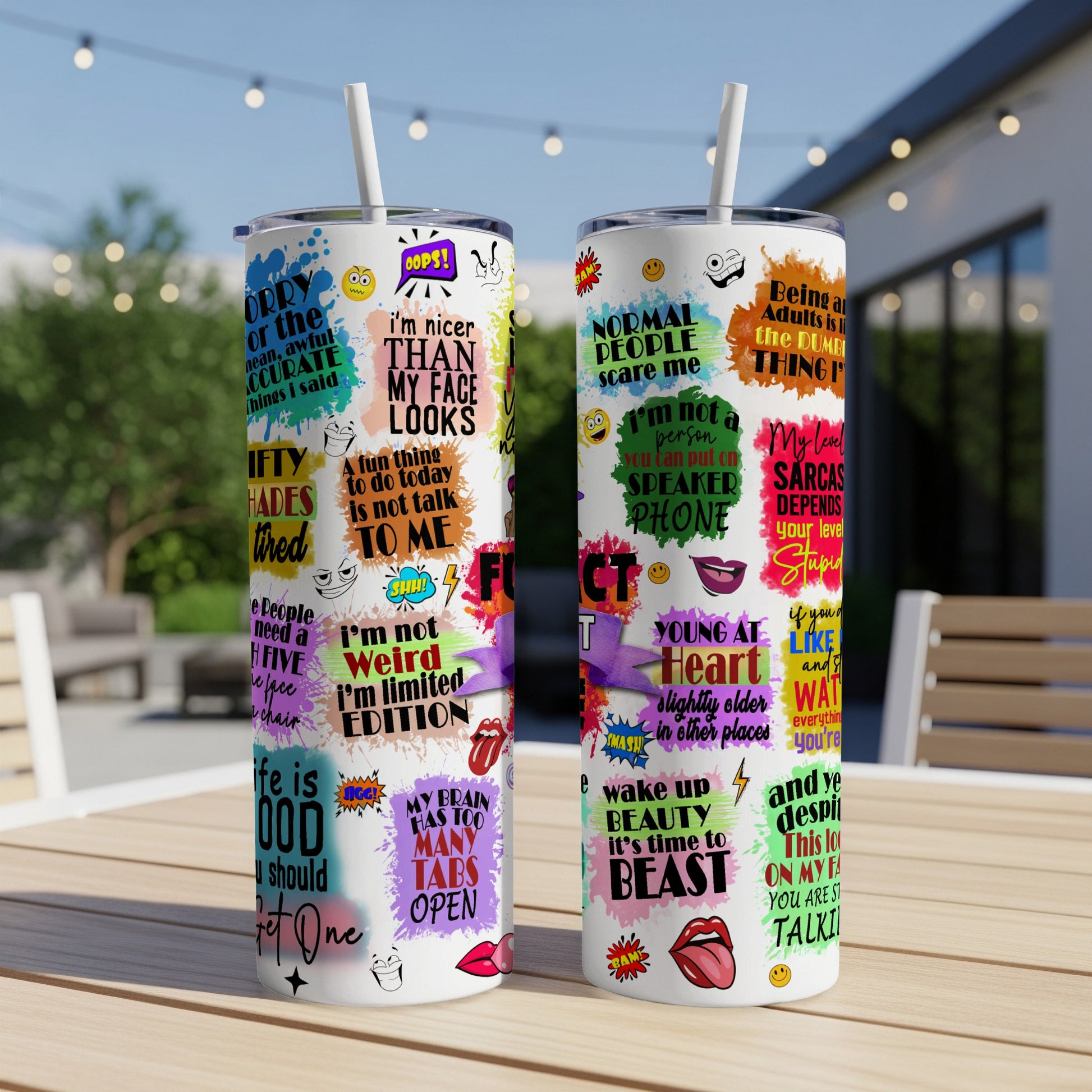 Two tumblers with colorful pop art designs featuring text and cartoon speech bubbles.