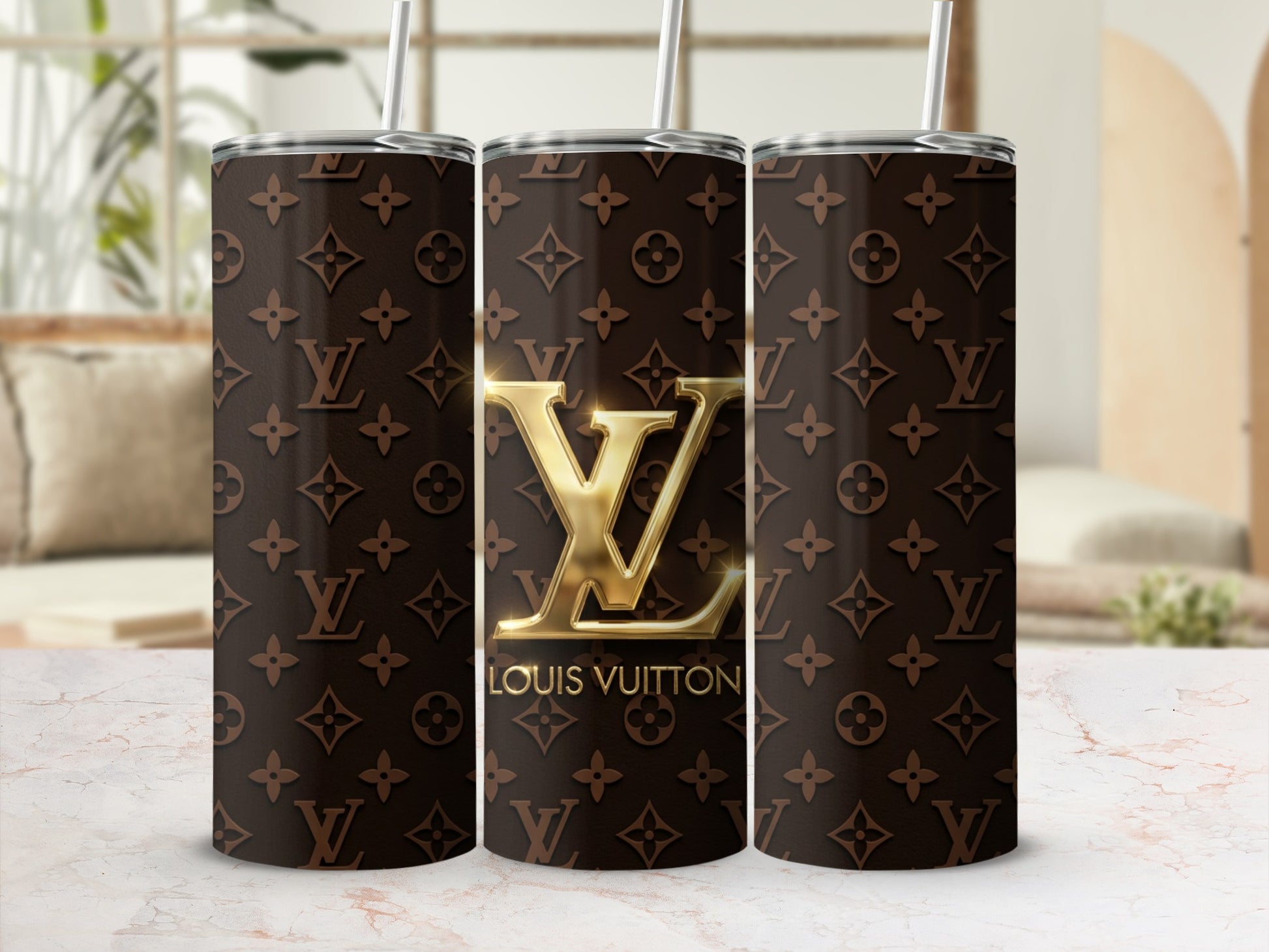 Three tumblers with a brown Louis Vuitton monogram pattern and gold LV logo.