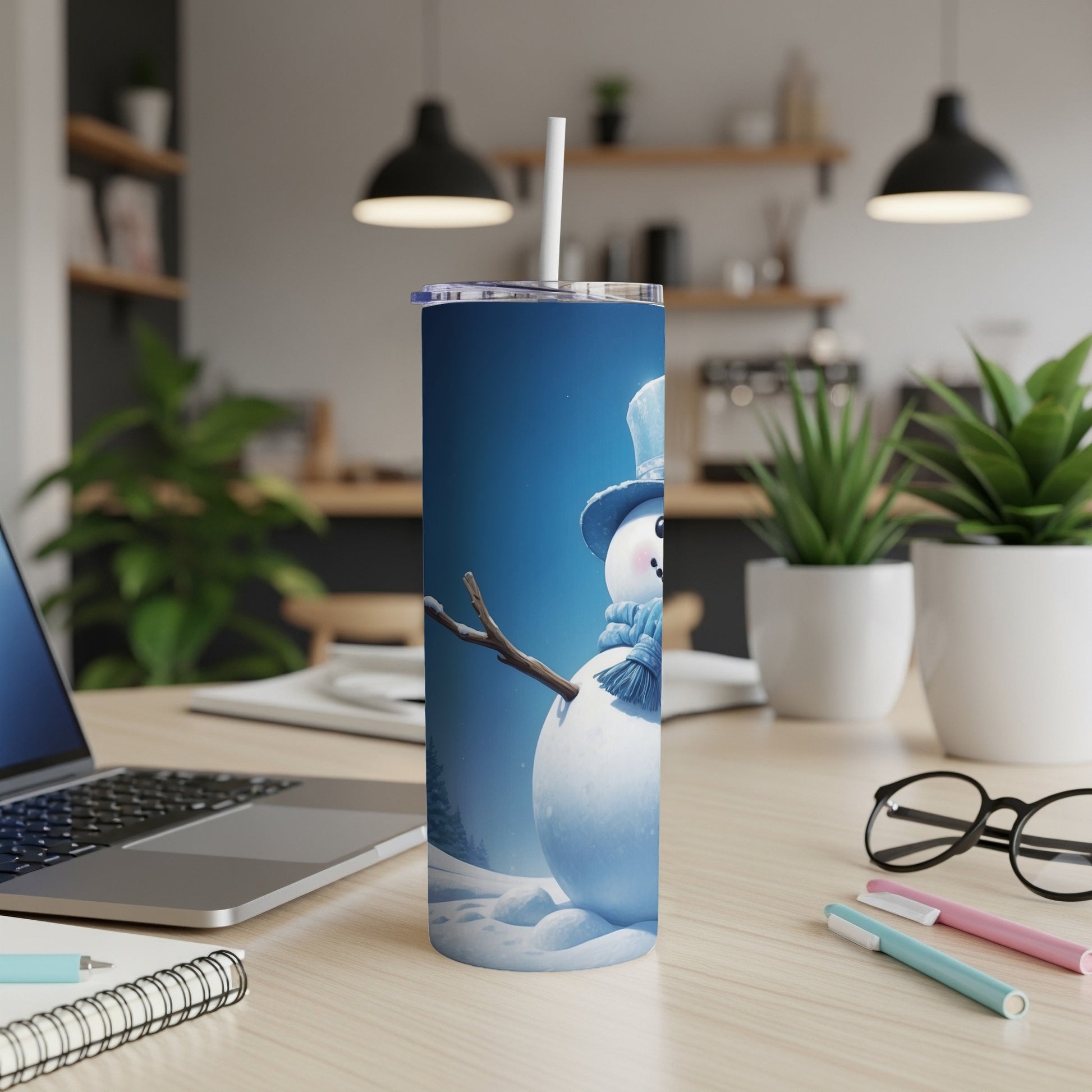 Snowman in a blue hat and scarf on a blue tumbler with a white straw.
