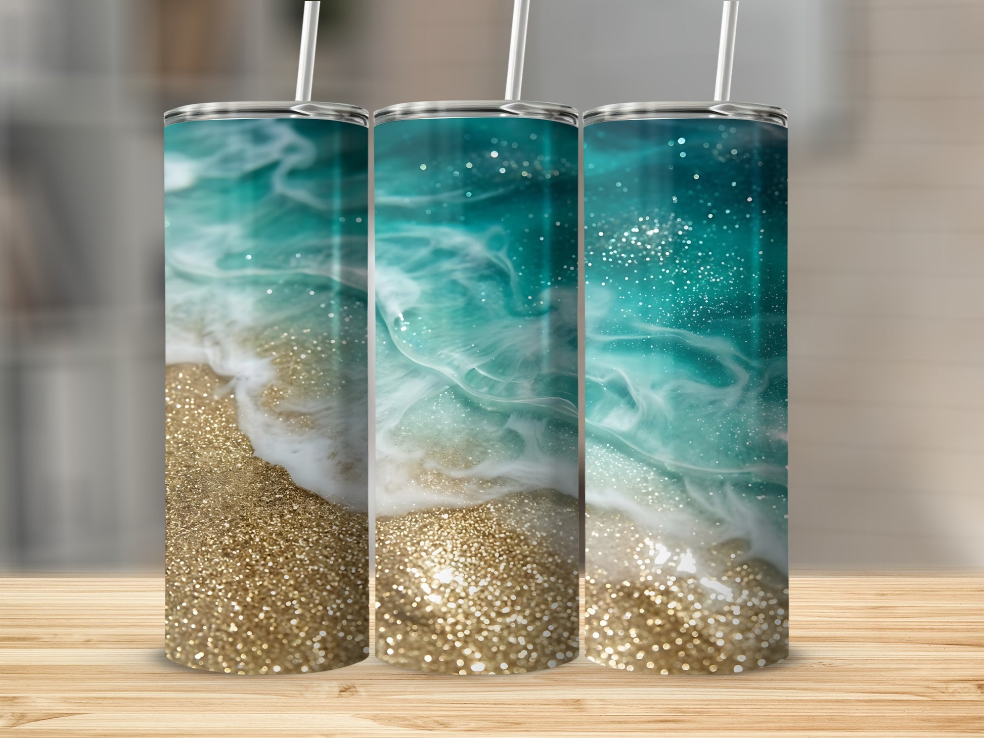 Three tumblers with a swirling ocean and glittery sand design.