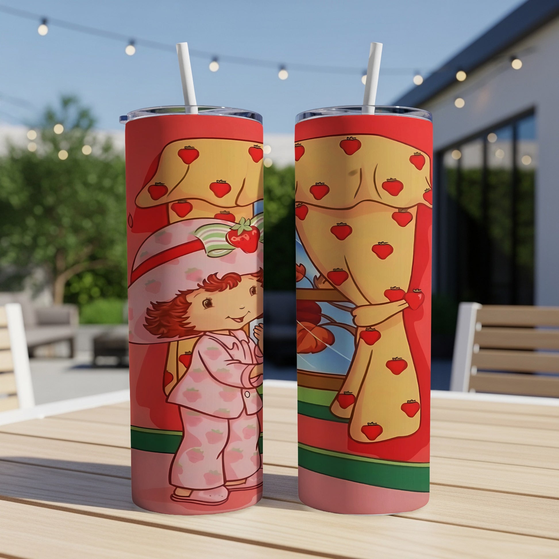 Strawberry Shortcake in pajamas with strawberry curtain pattern on tumblers.