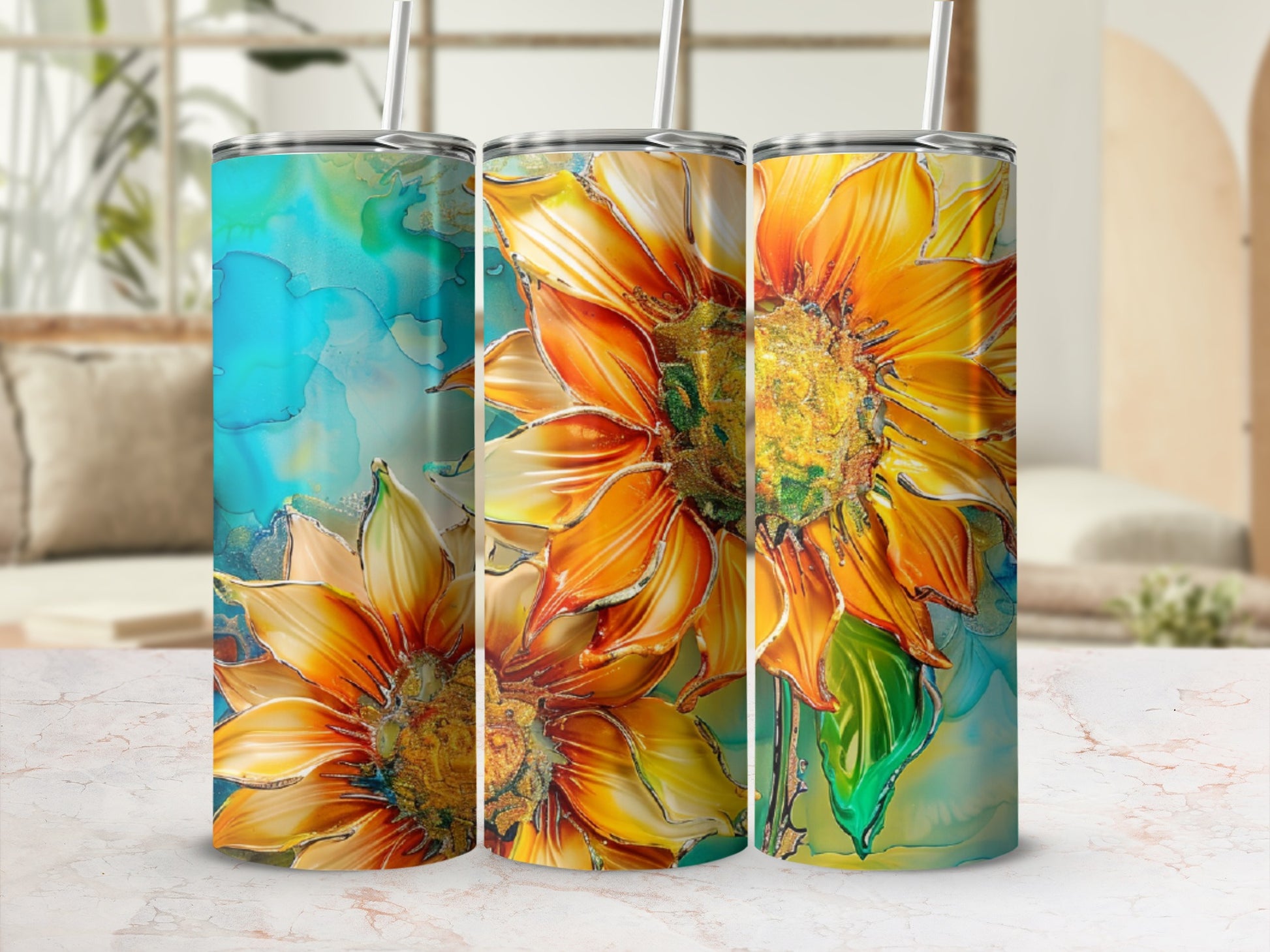 Three tumblers with abstract sunflower art on a marble countertop.