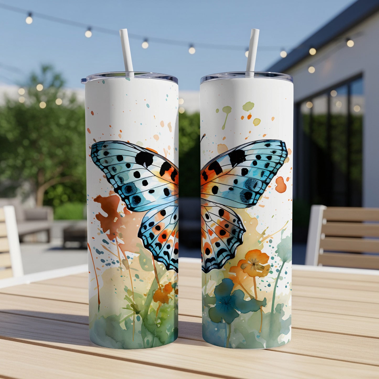 Two skinny tumblers featuring a watercolor butterfly and floral design.