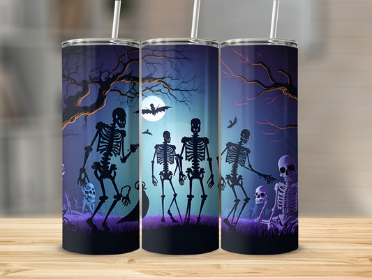 Halloween tumblers with skeletons, bats, and a full moon scene.