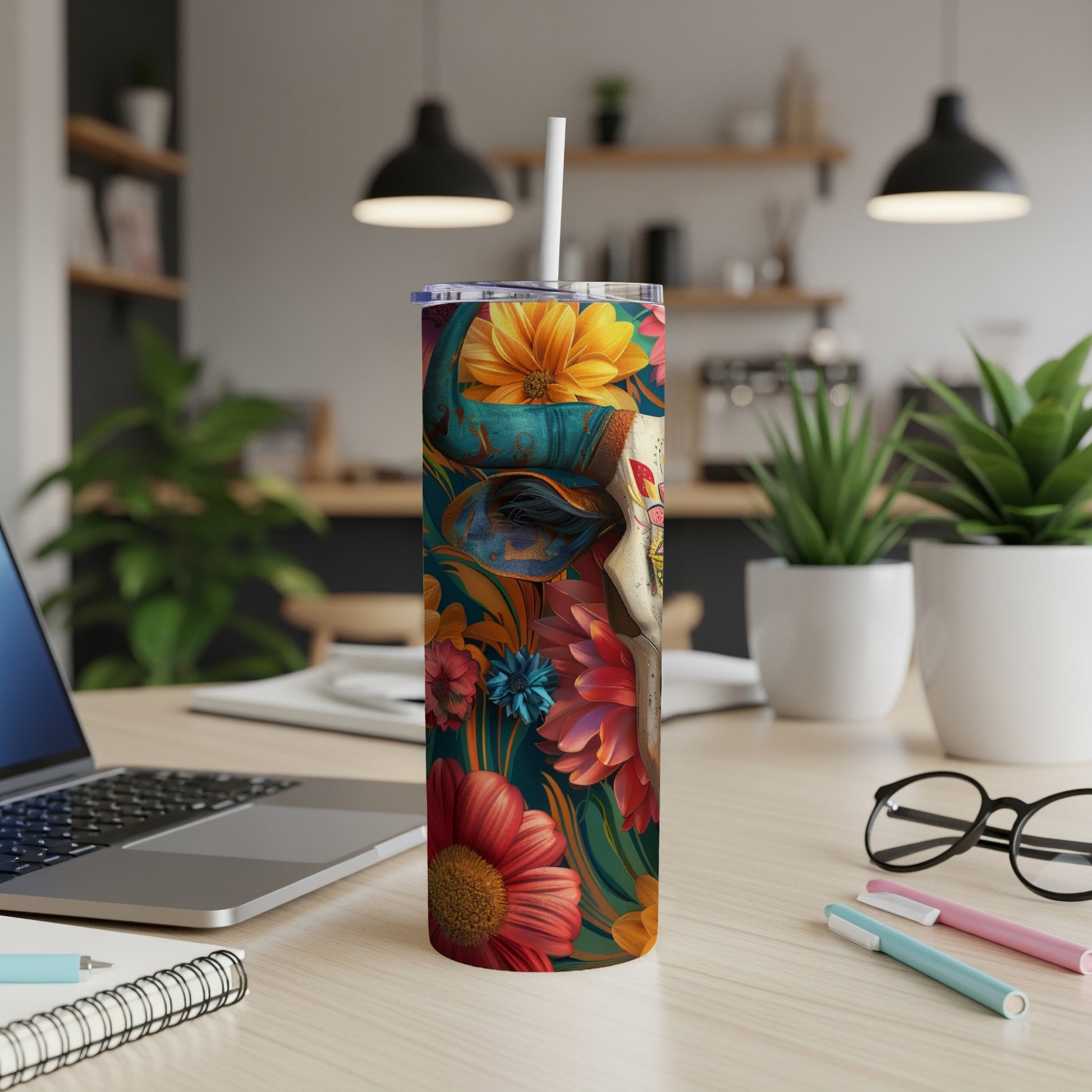 Cow skull with floral pattern on a stainless steel tumbler.
