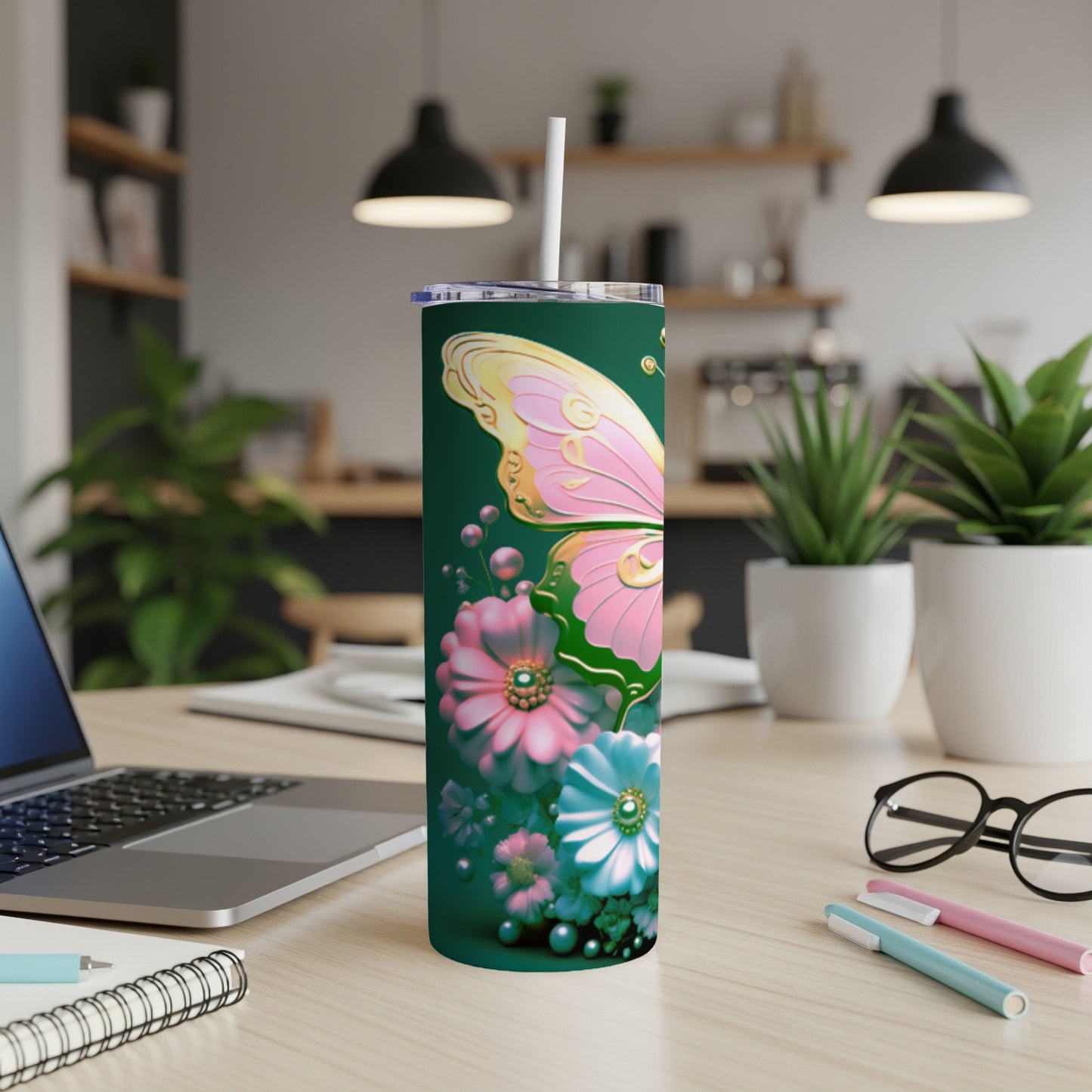 Green tumbler with pink butterfly and floral accents.