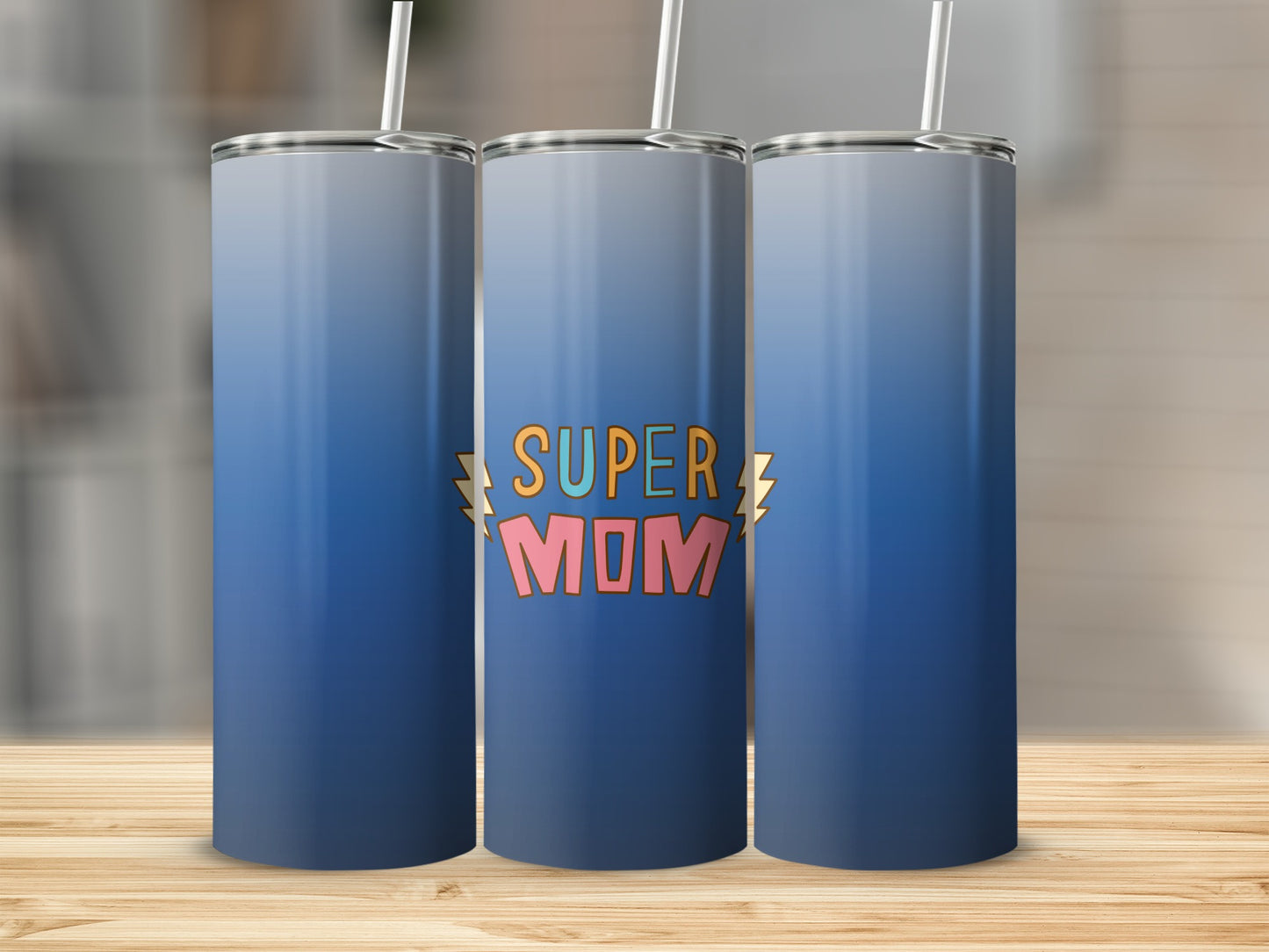 Blue gradient tumbler with "SUPER MOM" text and lightning bolt graphics.