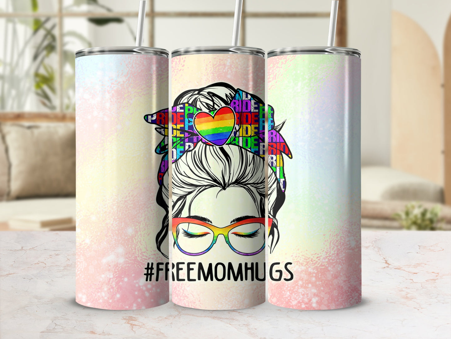 Tumbler with rainbow colors, "#FREEMOMHUGS" text, and woman in glasses.
