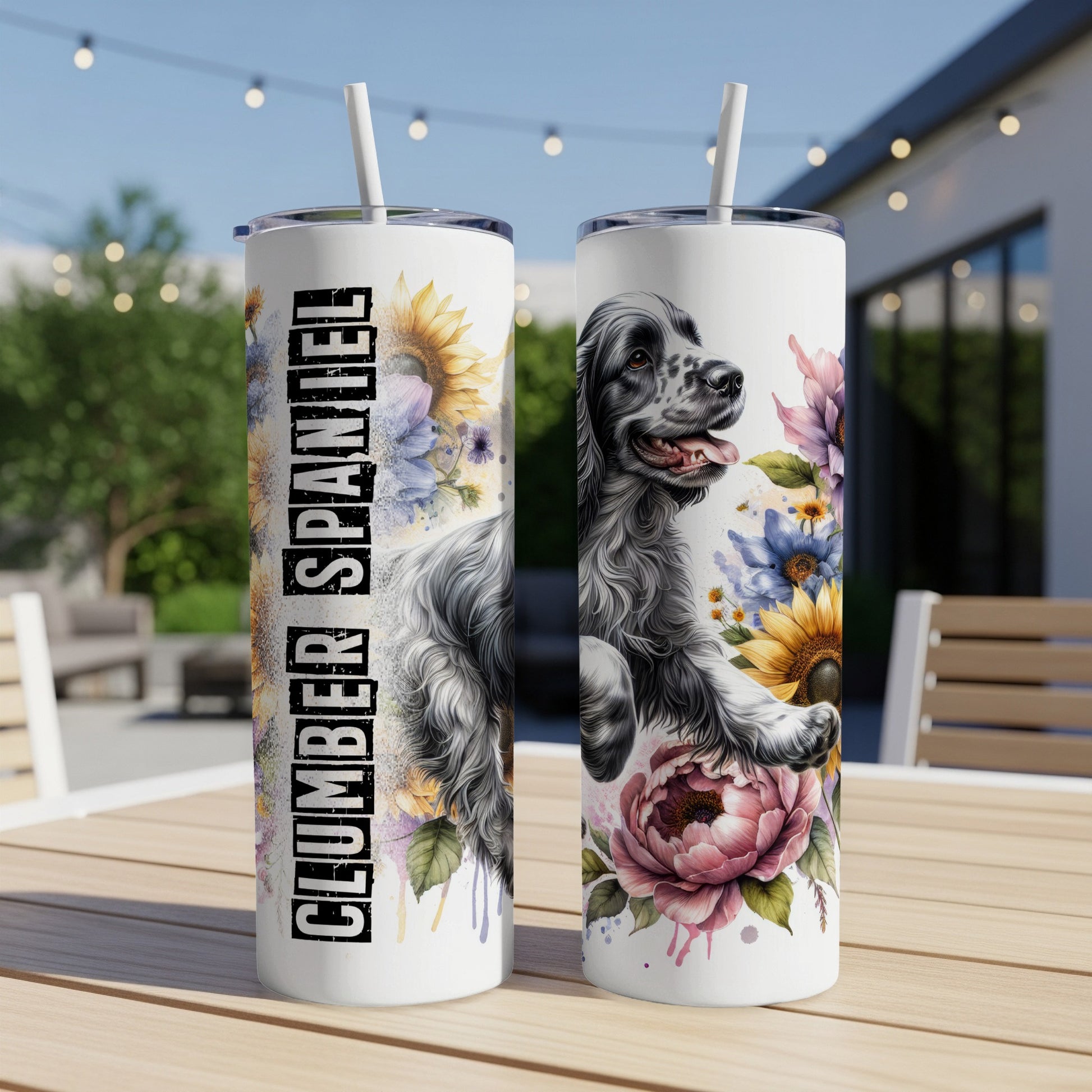 Clumber Spaniel on a floral tumbler with straw.