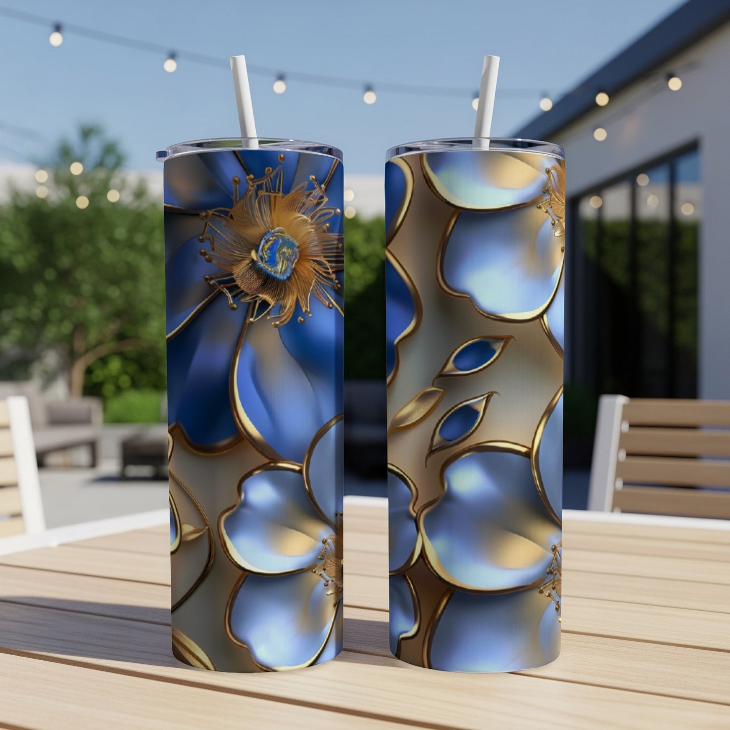 Two tumblers with blue and gold floral patterns on a wooden table.