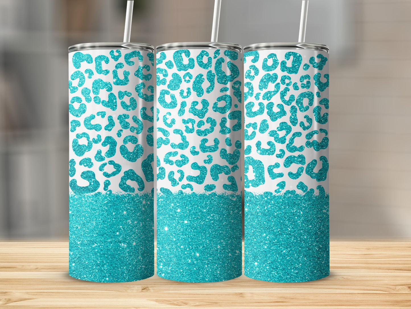 Three tumblers with teal leopard print and glitter bottom.