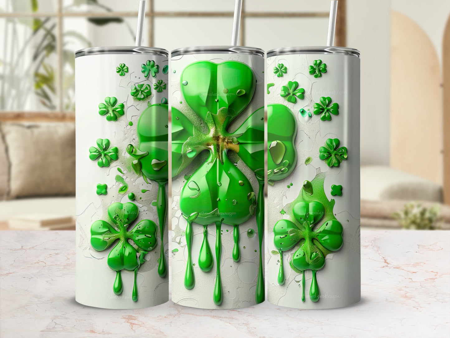 Three white tumblers with green shamrock and dripping paint design.