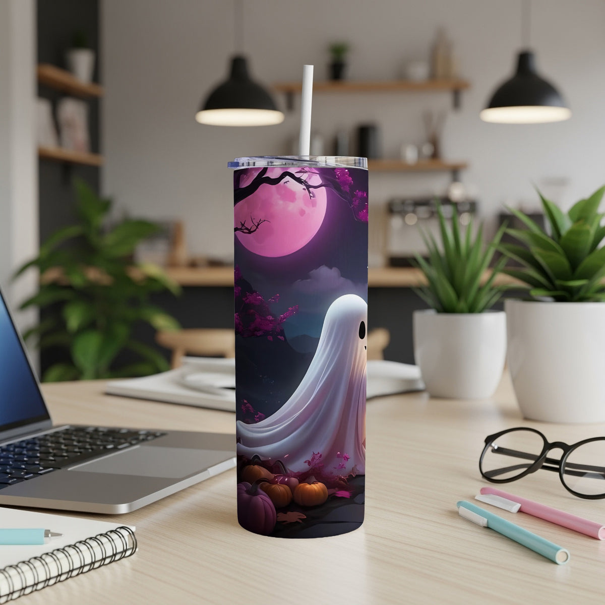 Tumbler with a ghost, pumpkins, and moon Halloween design.