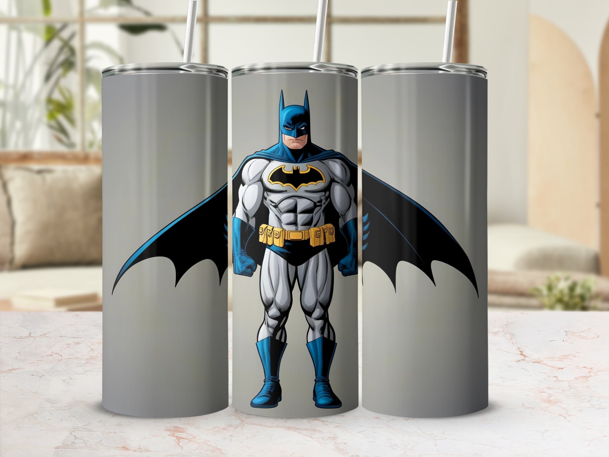 Batman illustration on three metal tumblers with straws.