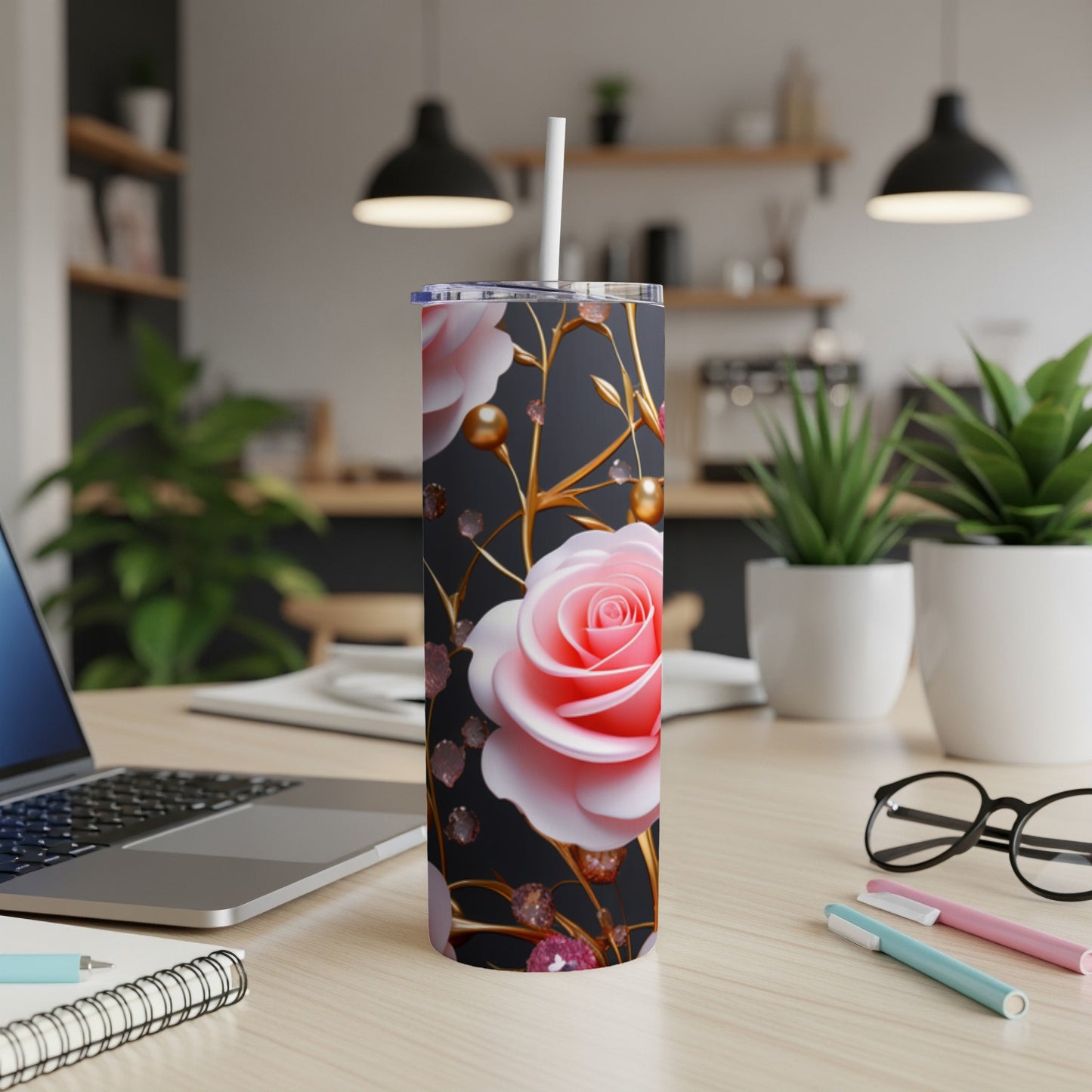 Pink rose pattern on a black tumbler with gold accents.