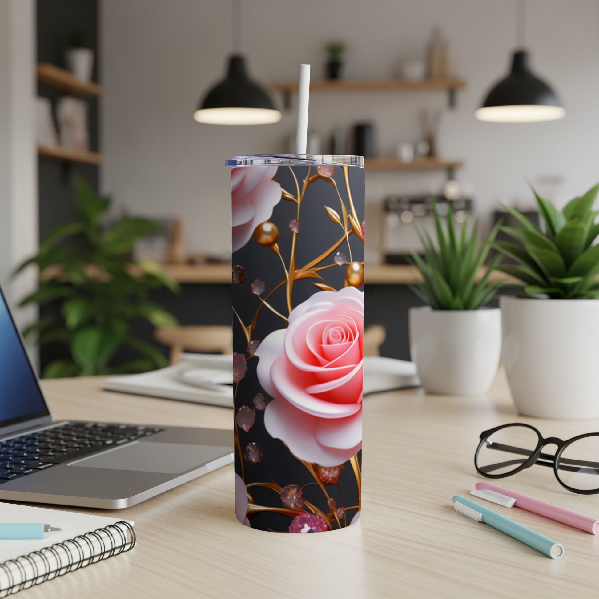 Pink rose pattern on a black tumbler with gold accents.