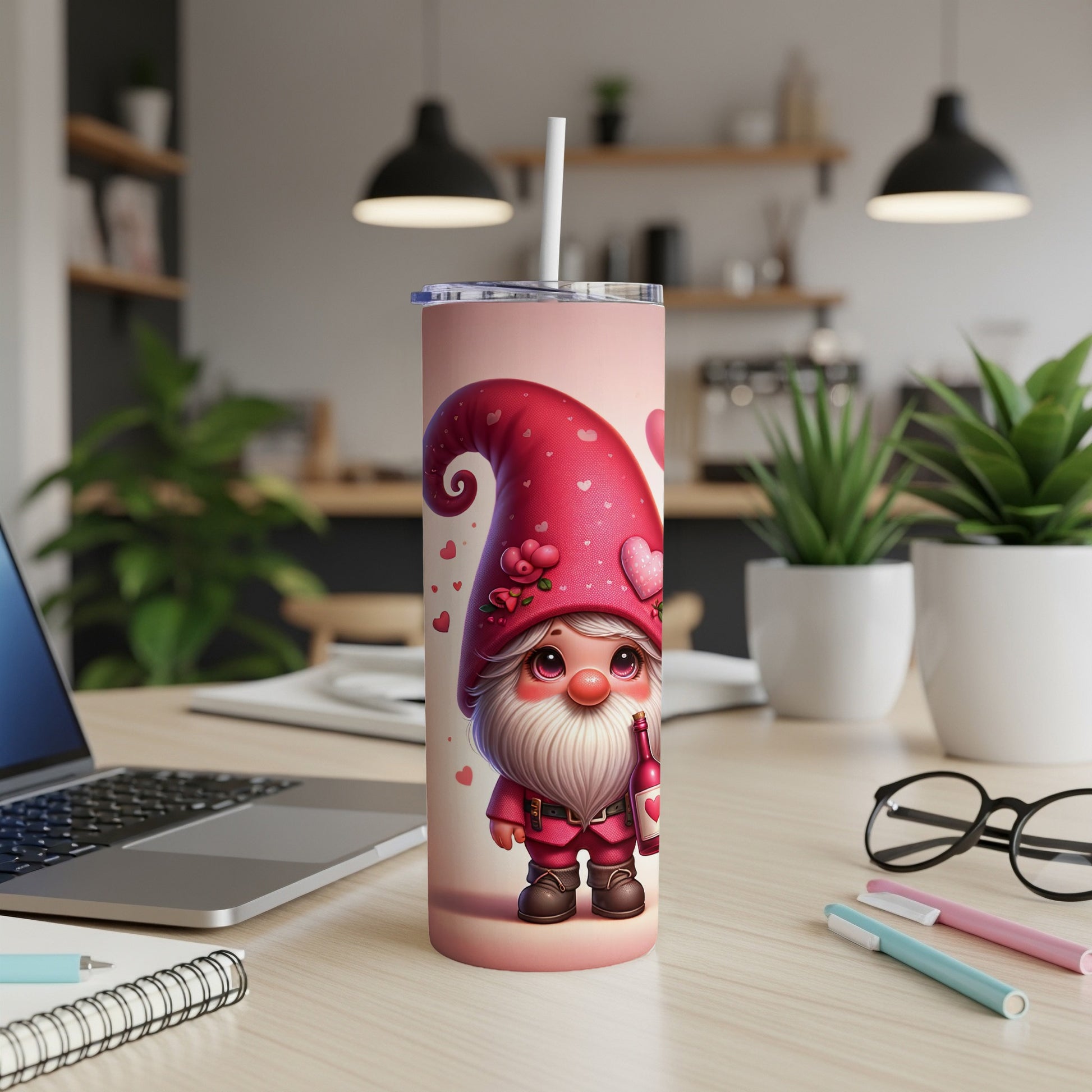 Pink gnome with hearts holding a bottle on a tumbler with a straw.