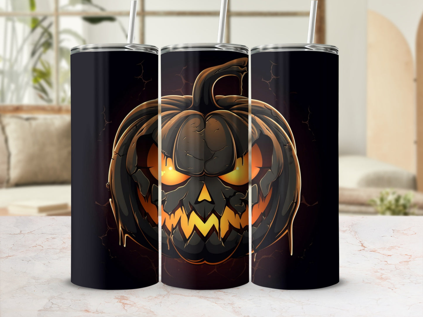Three tumblers display a spooky jack-o'-lantern design with glowing eyes.