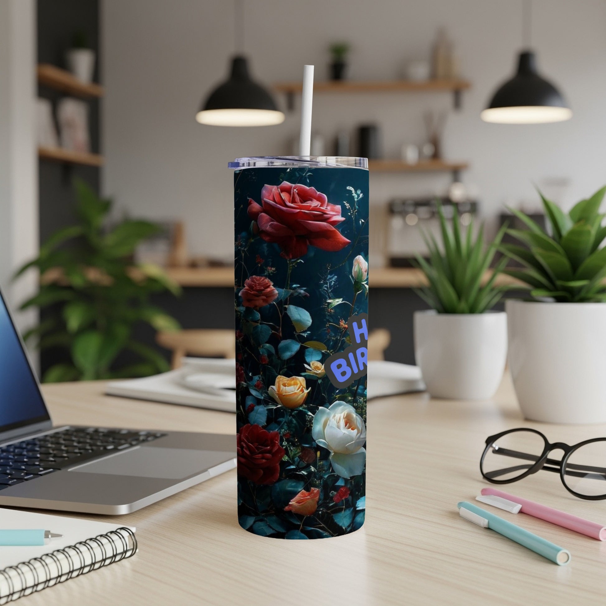 Tumbler with floral design and "Happy Birthday" text.