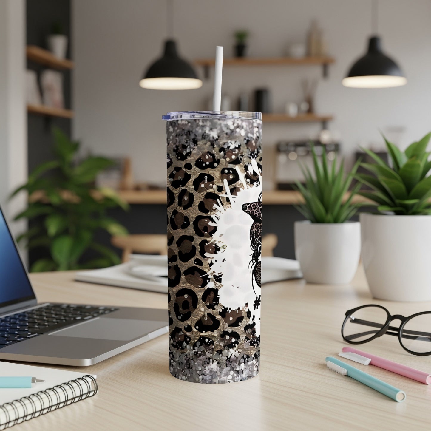 Glittery leopard print tumbler with a white unicorn design.