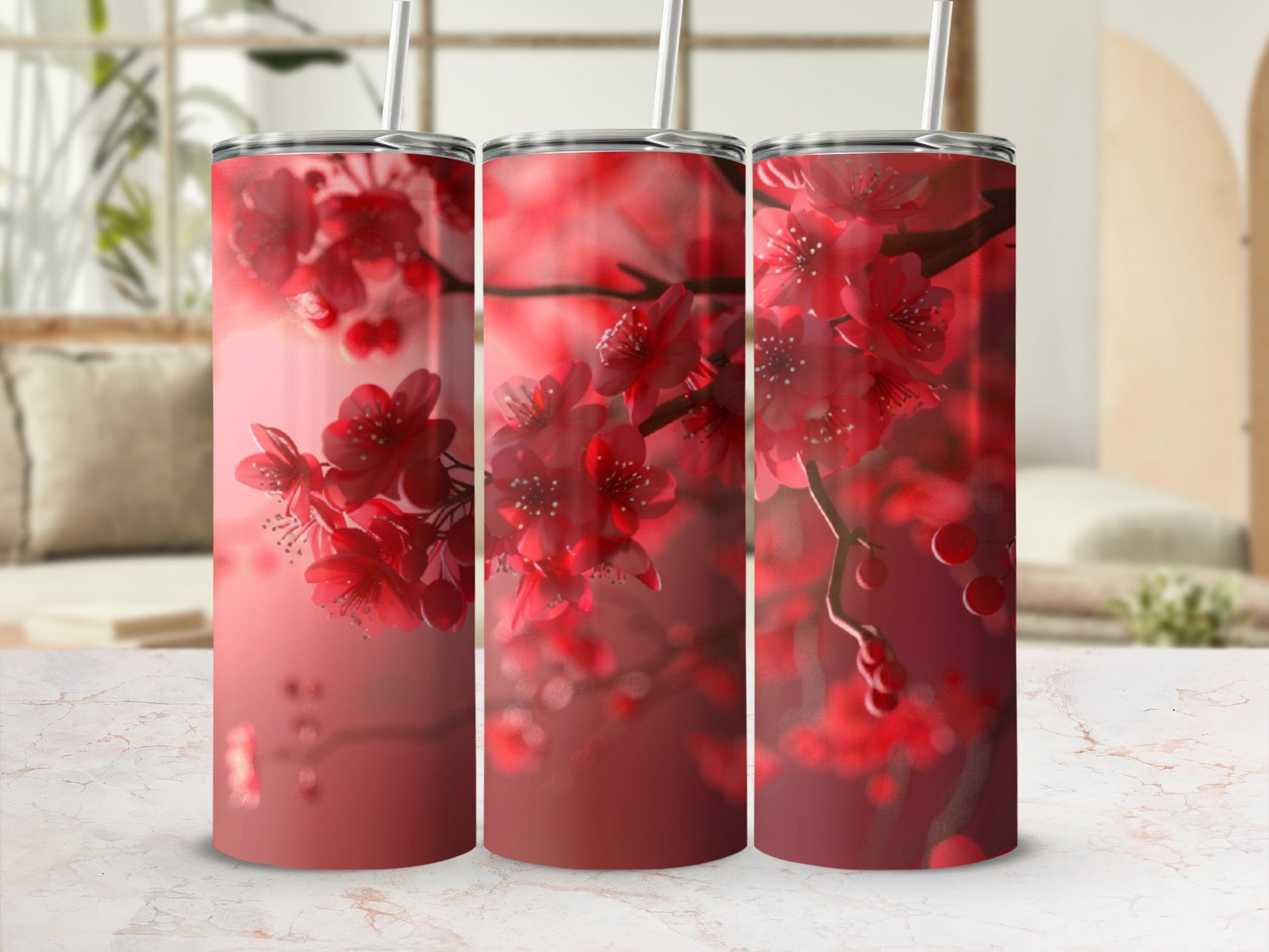 Three tumblers with a close-up of red cherry blossoms on a blurred background.