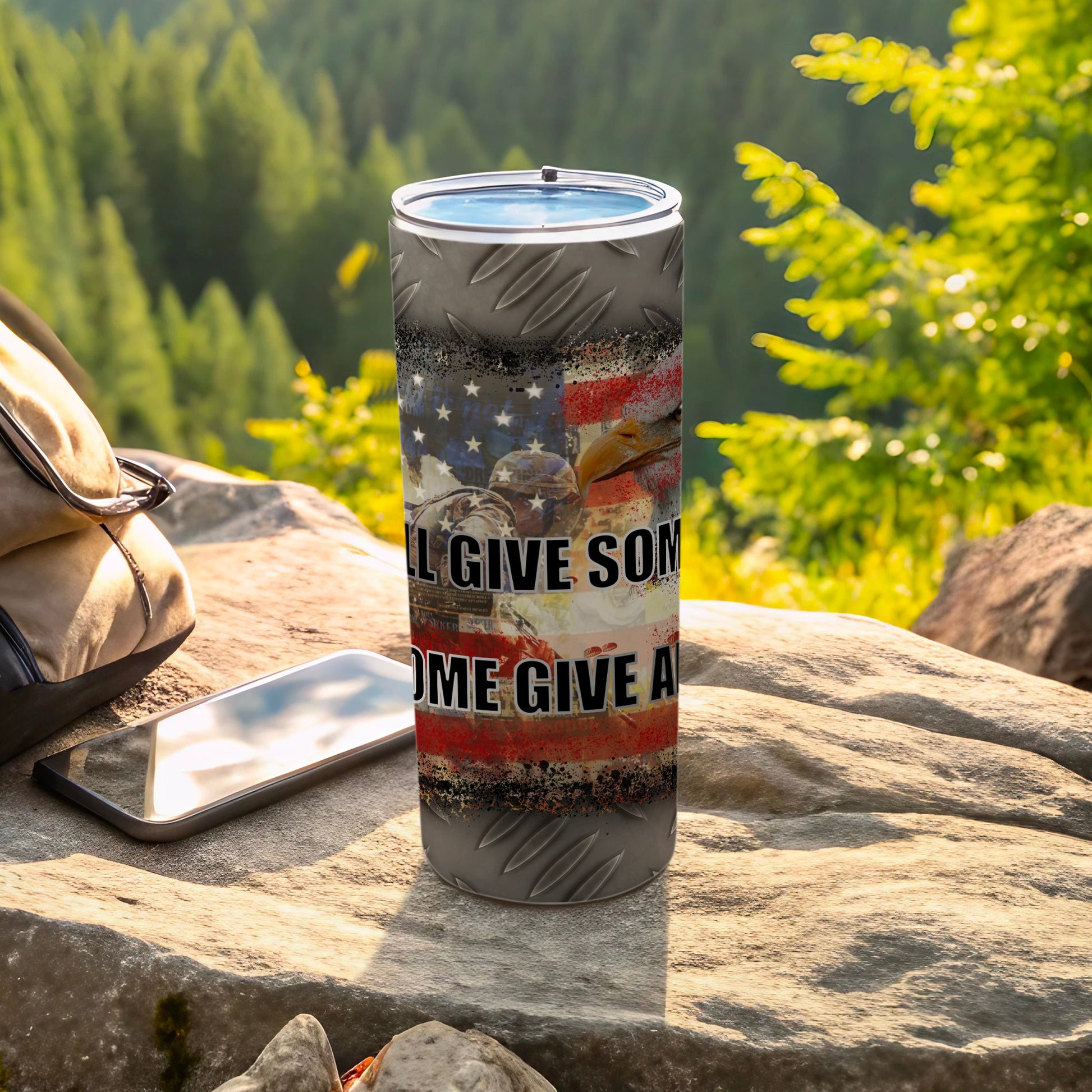 Gray tumbler with American flag, eagle, and text "I'LL GIVE SOMEONE A HOME".