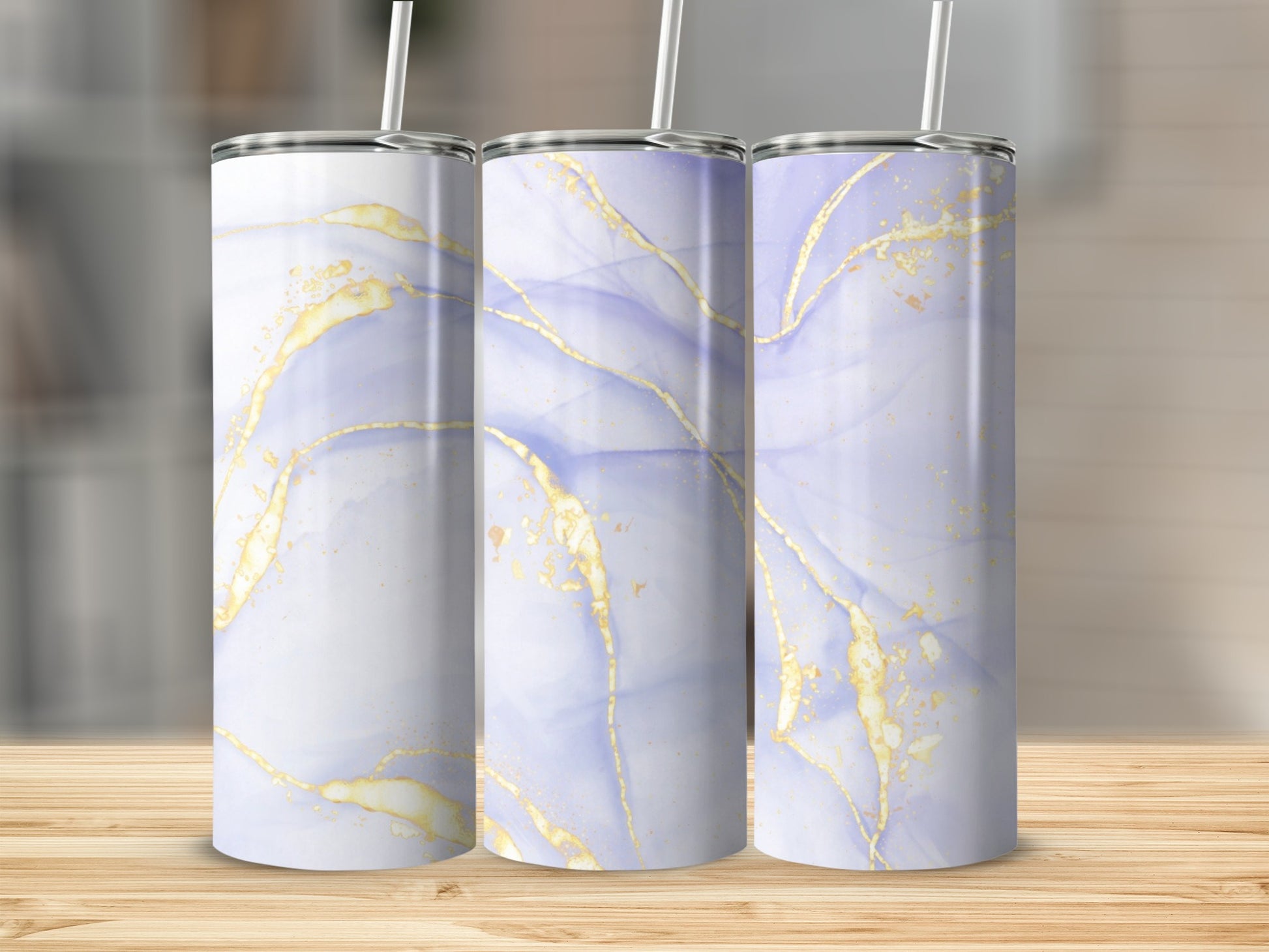 Three tall tumblers with abstract watercolor and gold marble patterns.