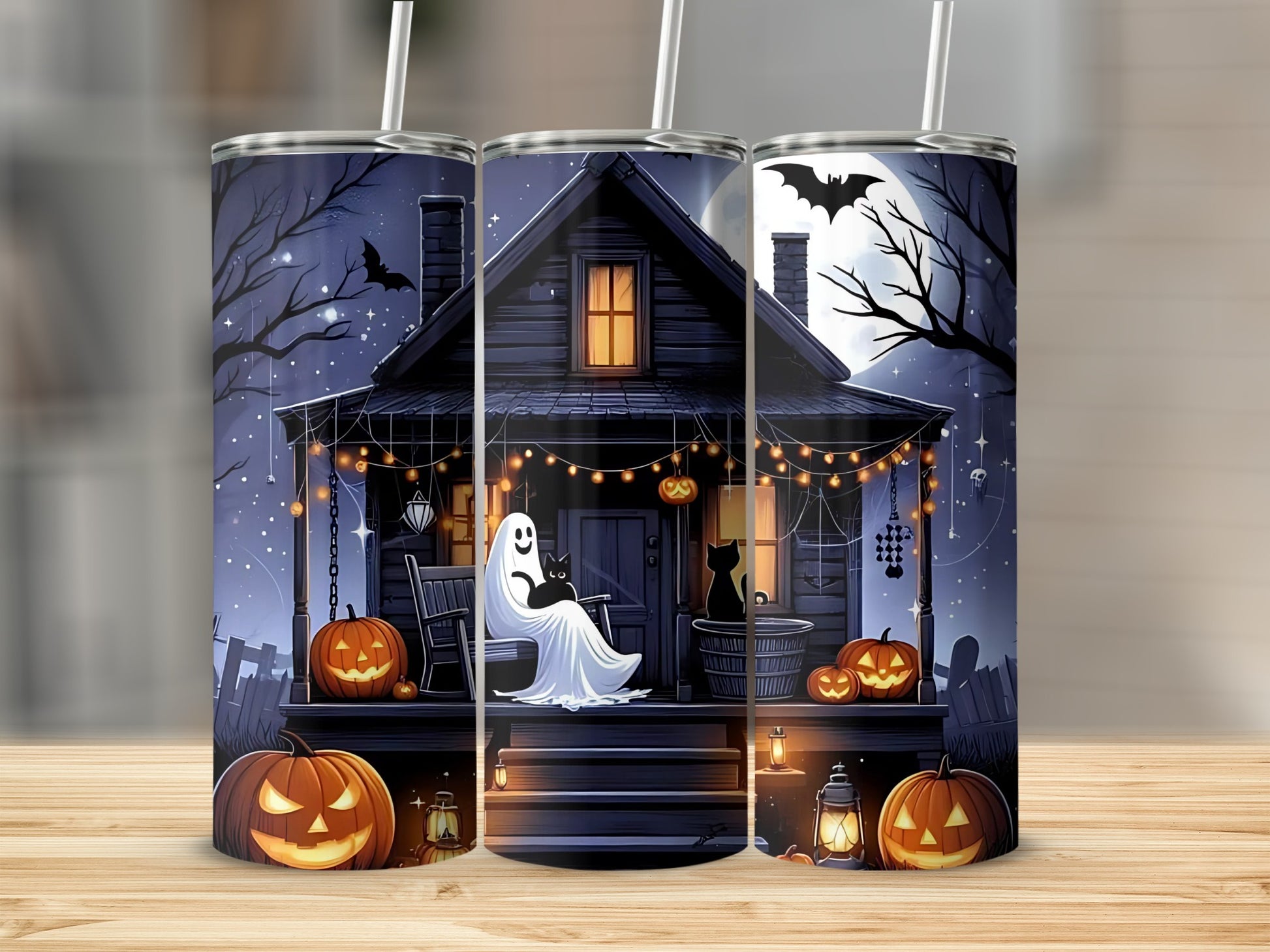 Halloween tumbler with spooky house, ghost, black cats, pumpkins, and bats.