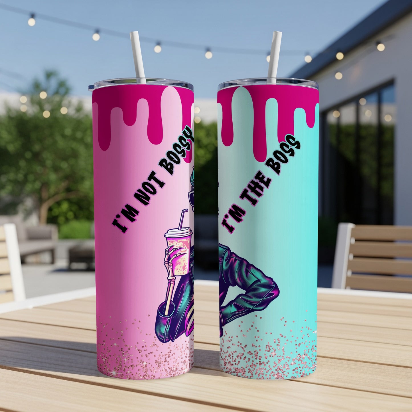 Two tumblers with spooky skeleton designs and text "I'm not bossy" and "I'm the boss".
