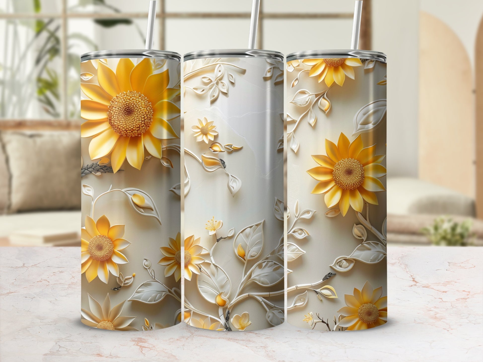 Three tumblers with sunflowers and floral relief on a light background.