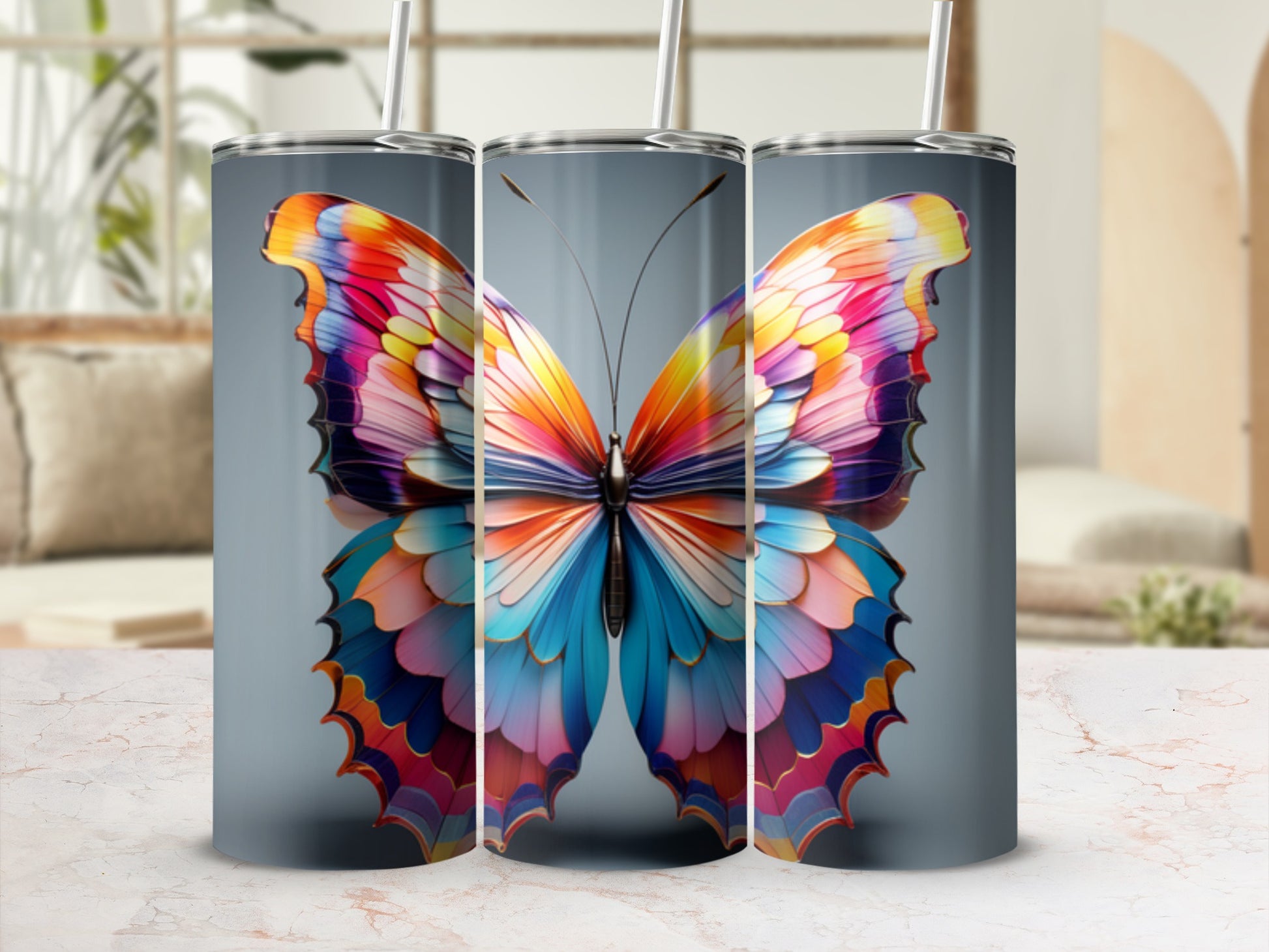 Three tumblers with colorful butterfly wings pattern.