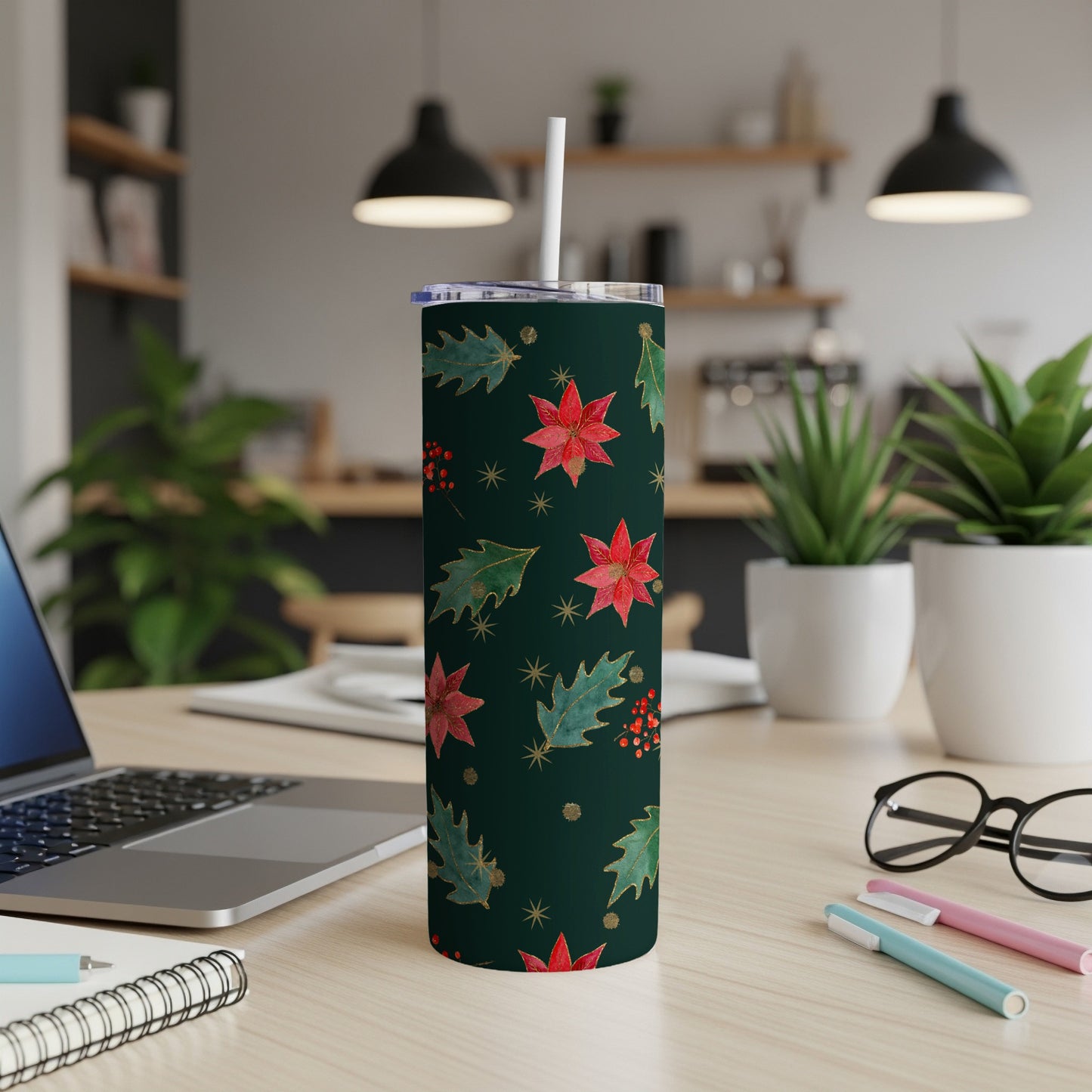 Dark green tumbler with poinsettias, holly leaves, and gold accents.