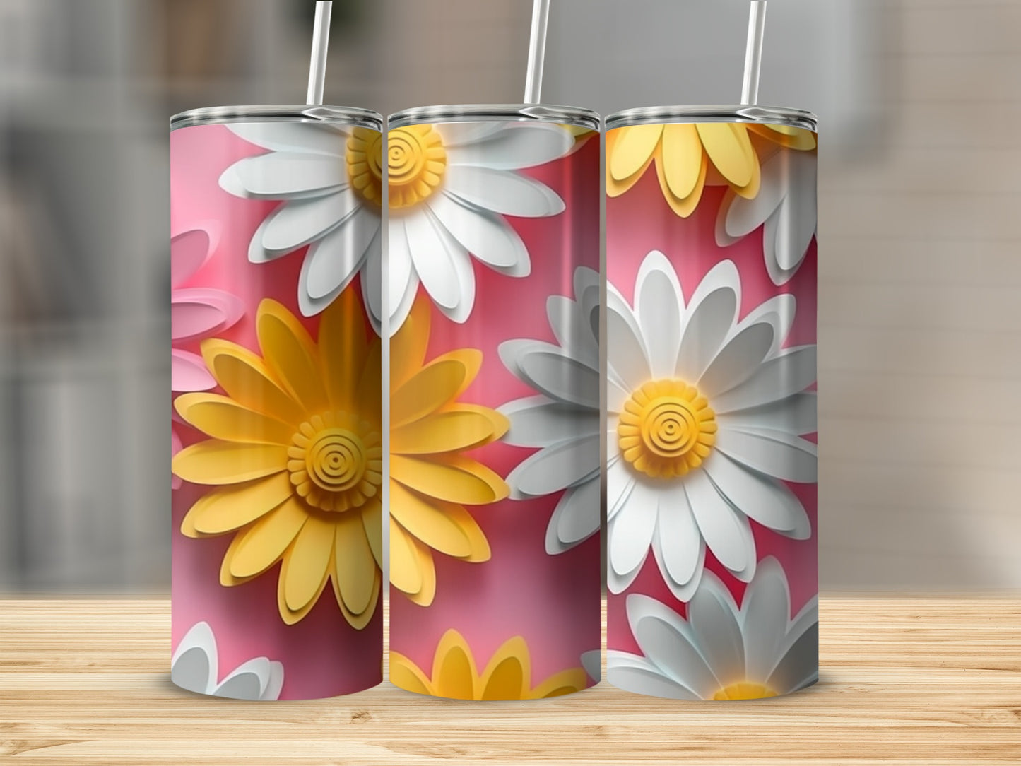 Three pink tumblers with raised yellow and white daisy designs.