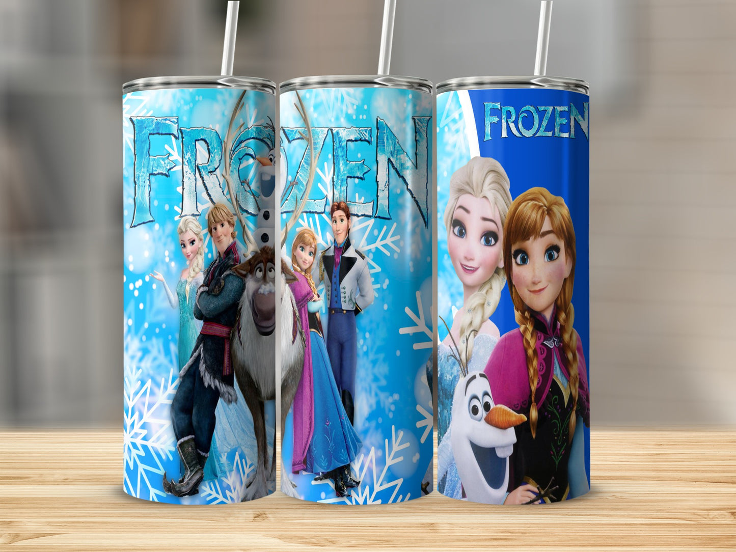 Frozen movie characters Elsa, Anna, Olaf, and Kristoff on three insulated tumblers.
