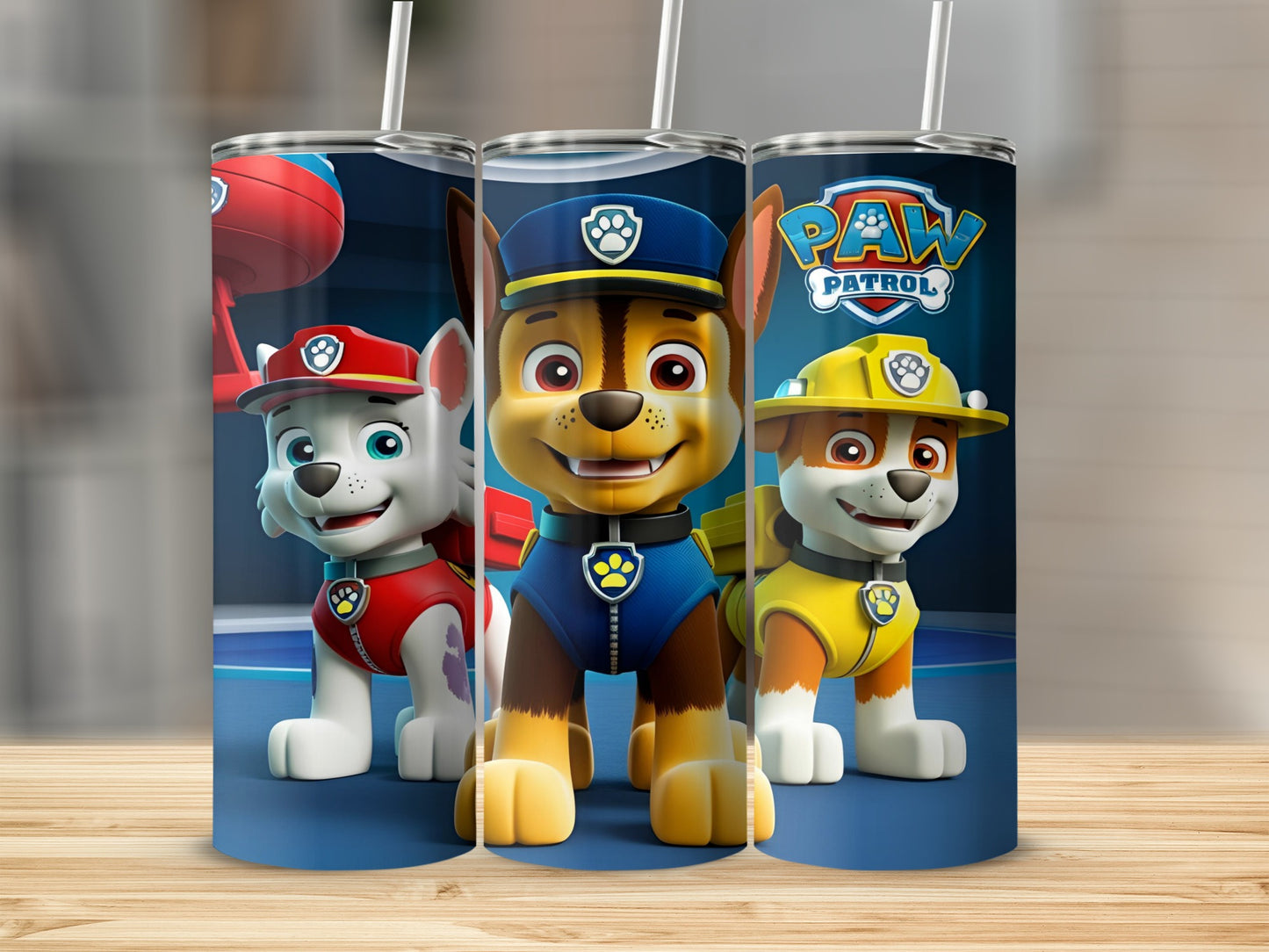 Paw Patrol characters Chase, Marshall, and Skye on a blue tumbler.