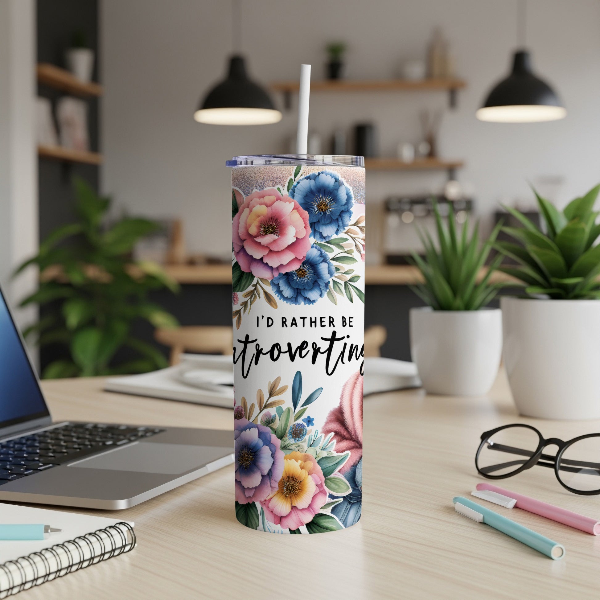 Tall tumbler with floral design and text "I'd rather be...".