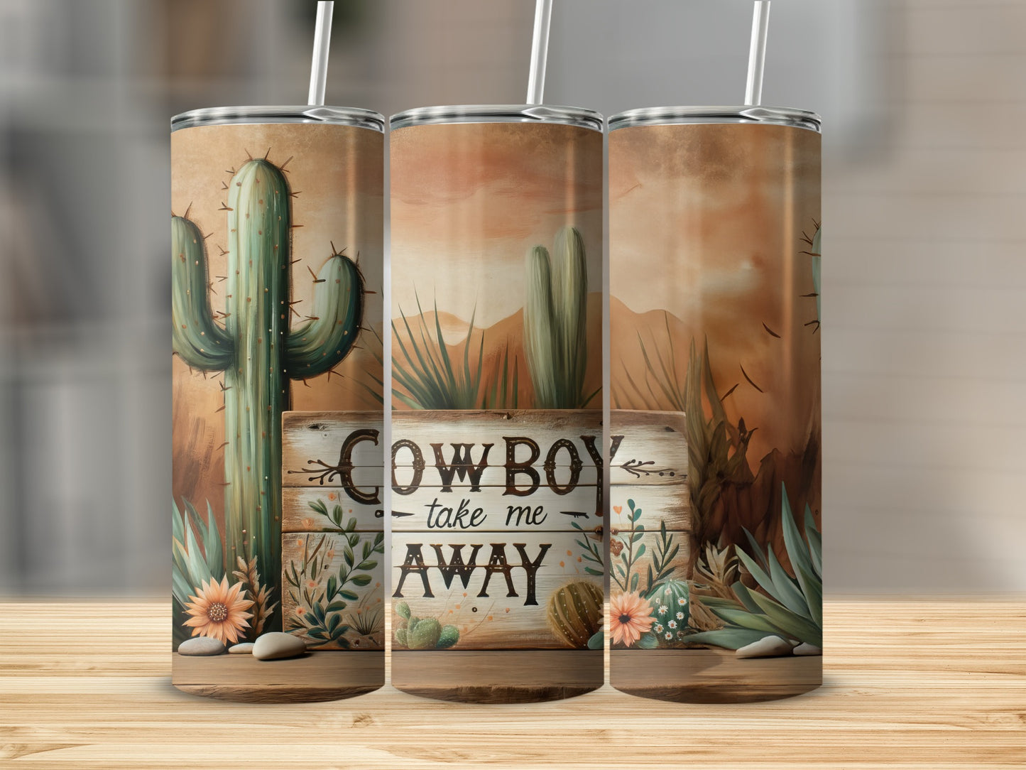 Triptych of tumblers with desert landscape and "Cowboy Take Me Away" text.