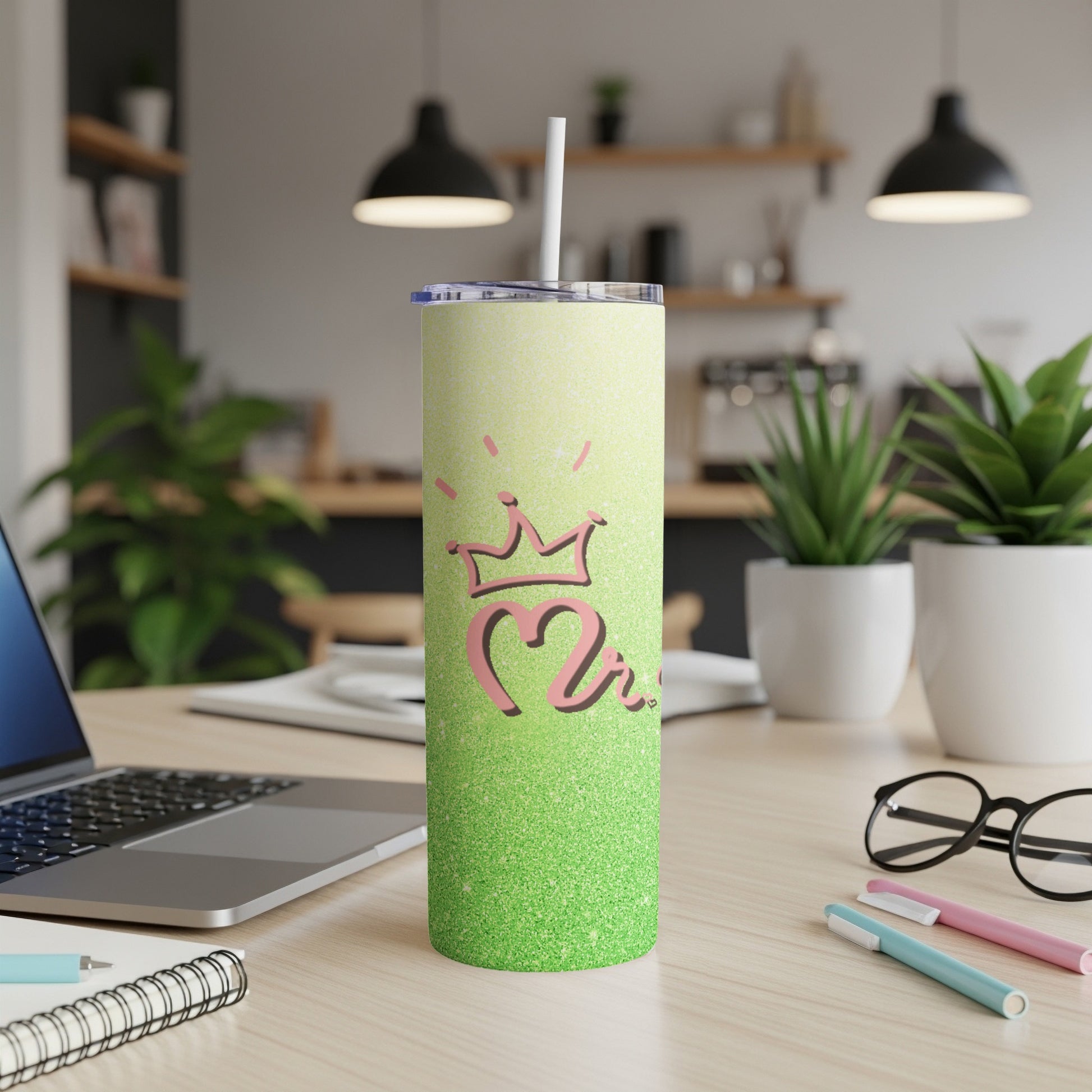 Glittery green tumbler with a pink crown and "2" design.