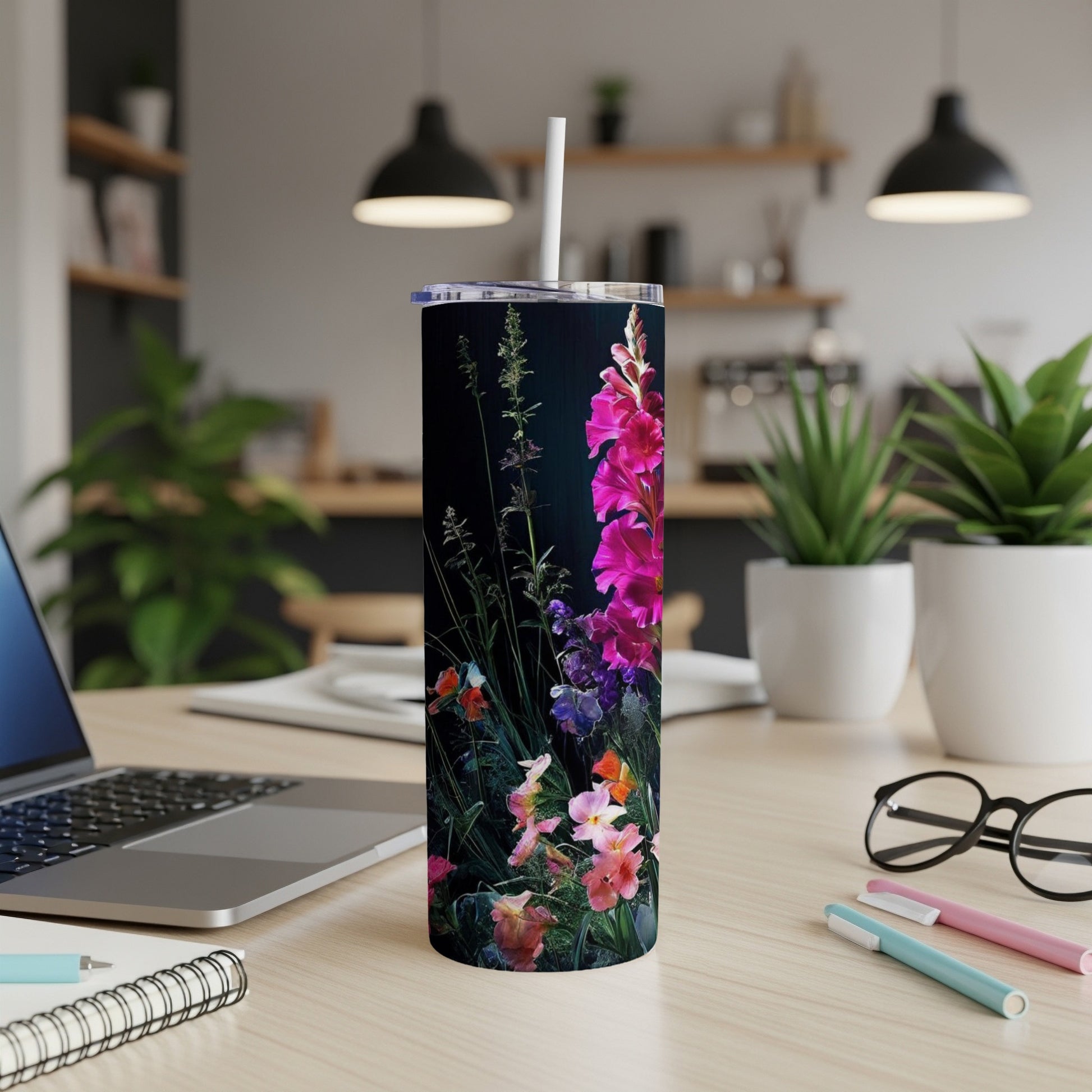 Floral tumbler with pink gladiolus and other flowers on a dark background.
